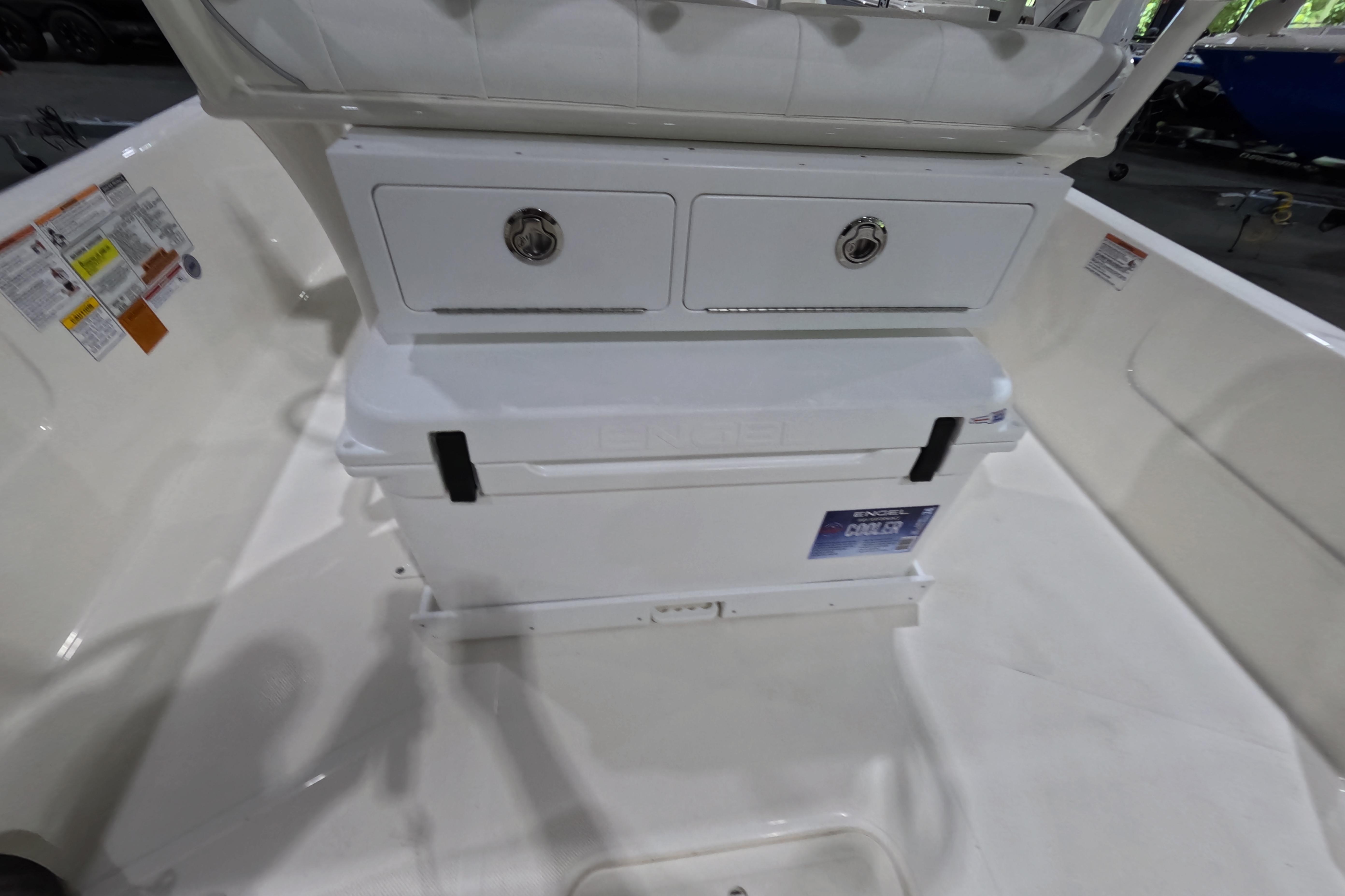 2026 Skeeter SX230 boat interior with storage compartments and cooler.