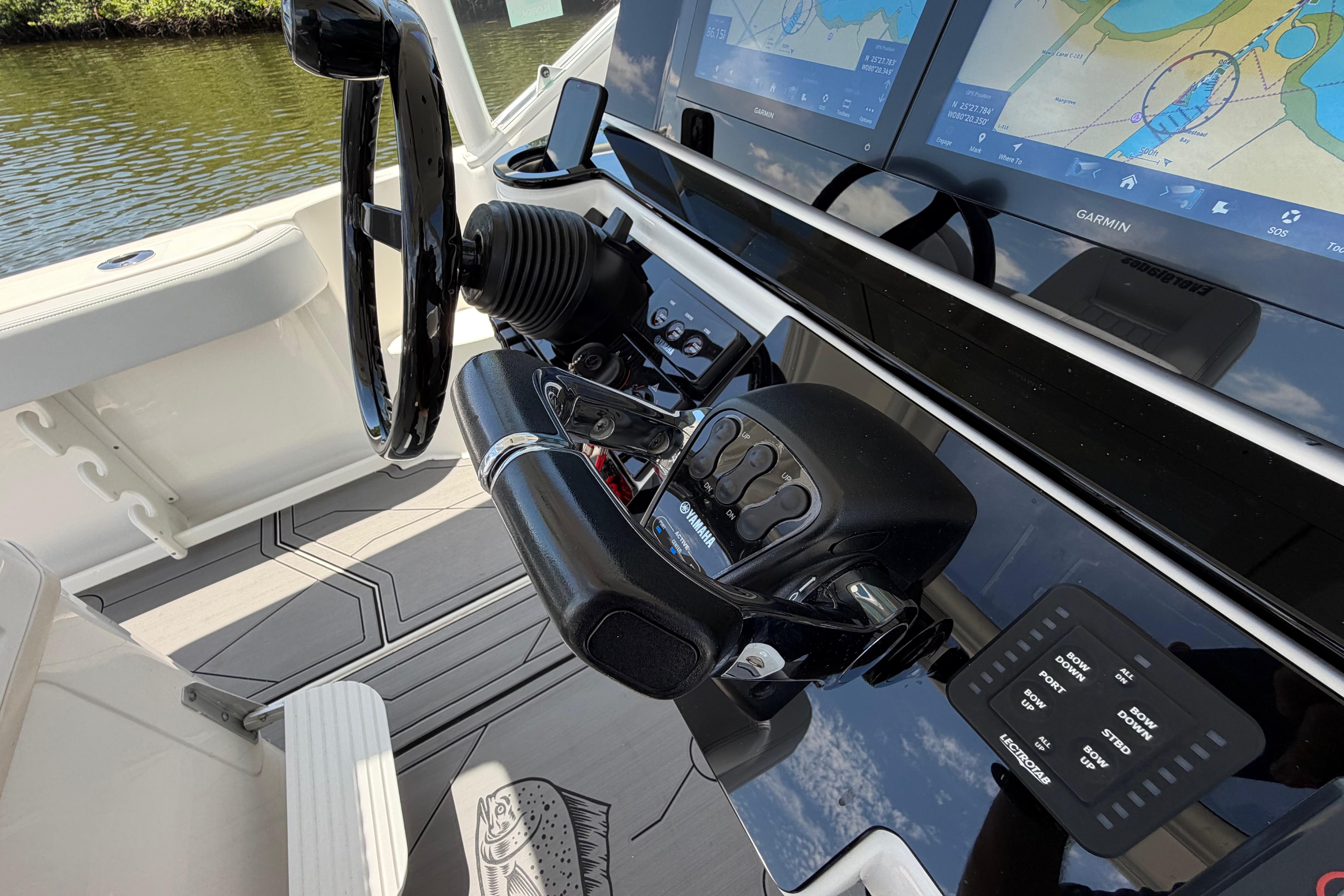 Control panel of a 2009 Everglades 350LX boat with Garmin navigation displays.