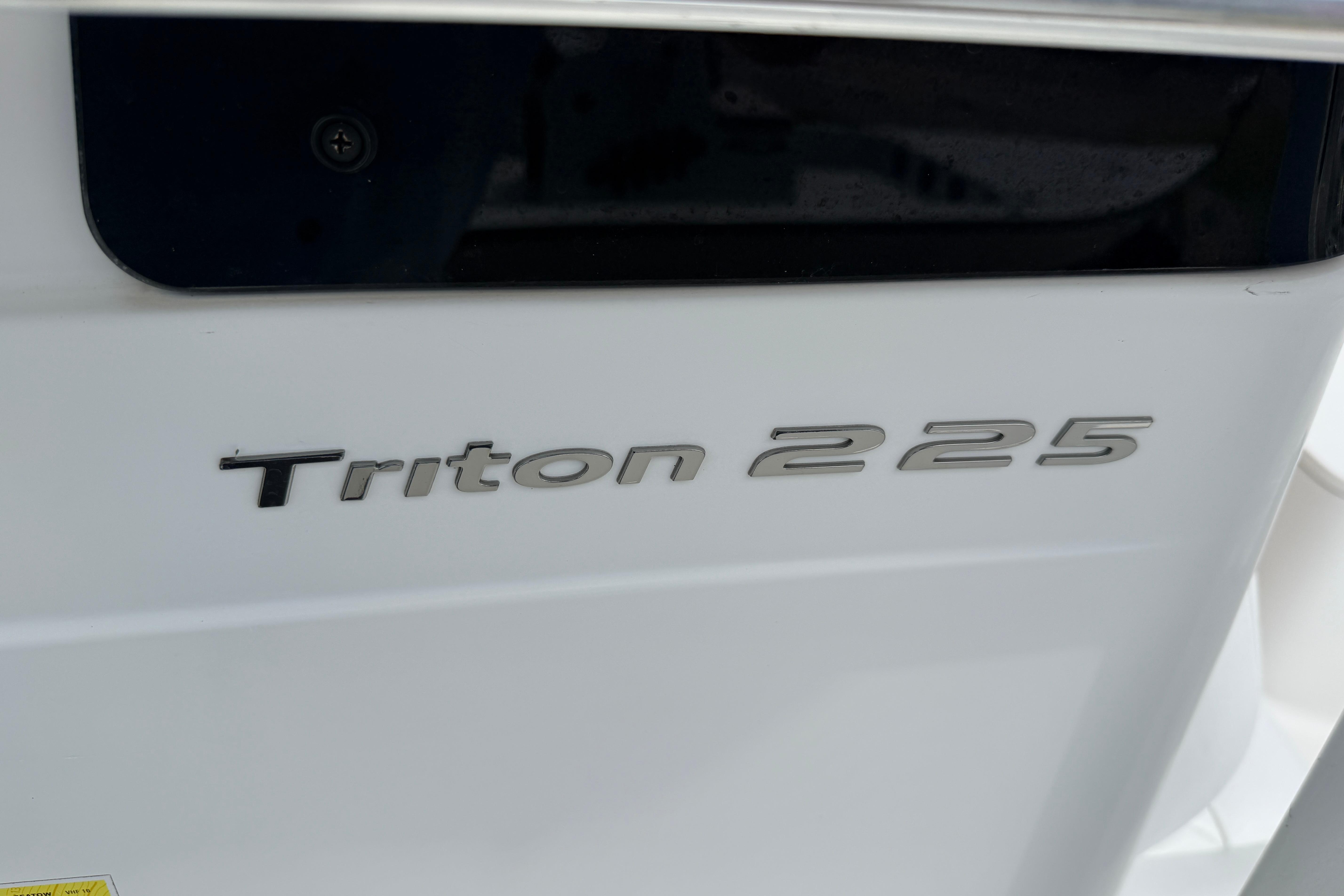 Close-up of 2015 Sea Hunt Triton 225 boat model nameplate.