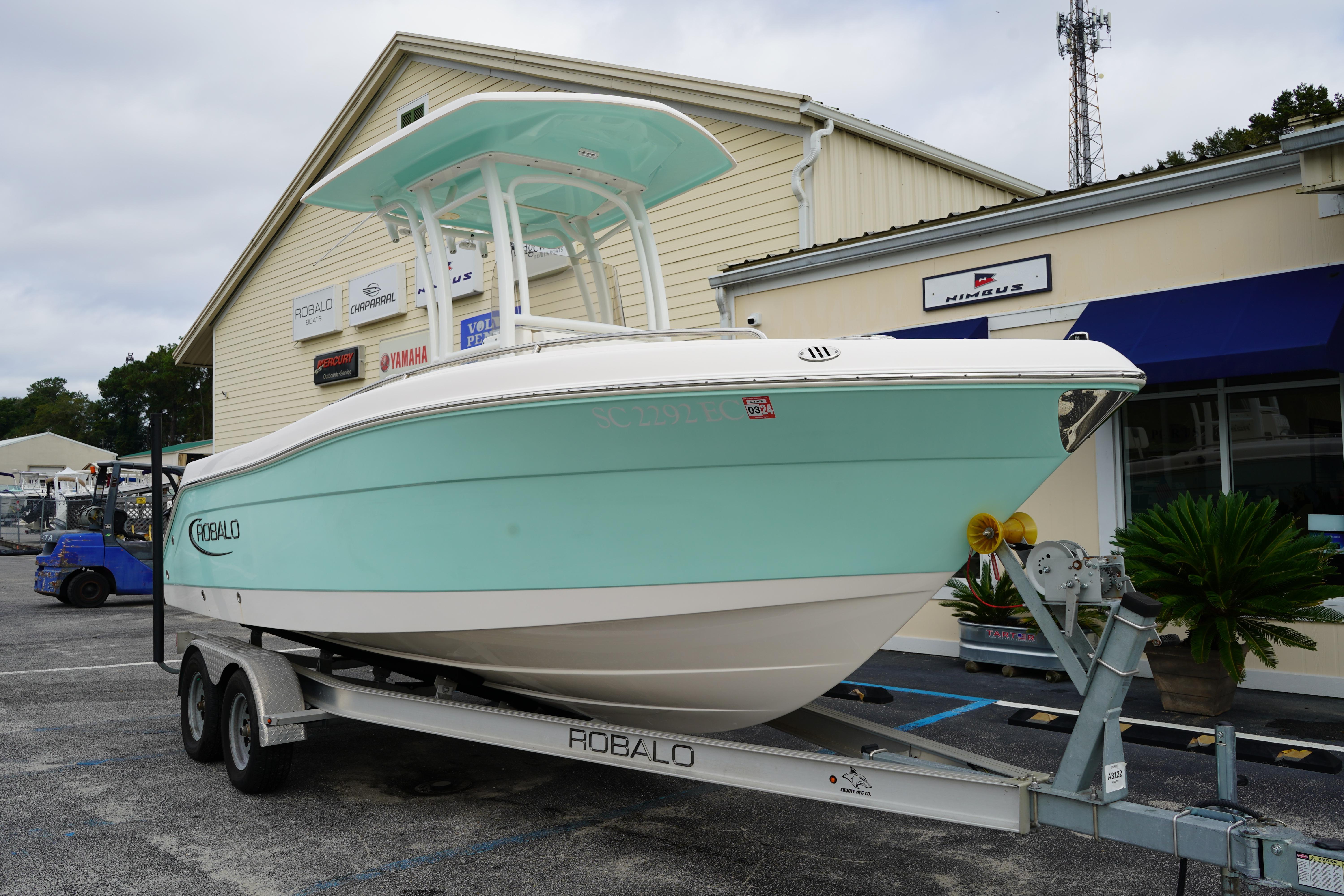 2023 Robalo R222 Center Console boat on trailer outside dealership.
