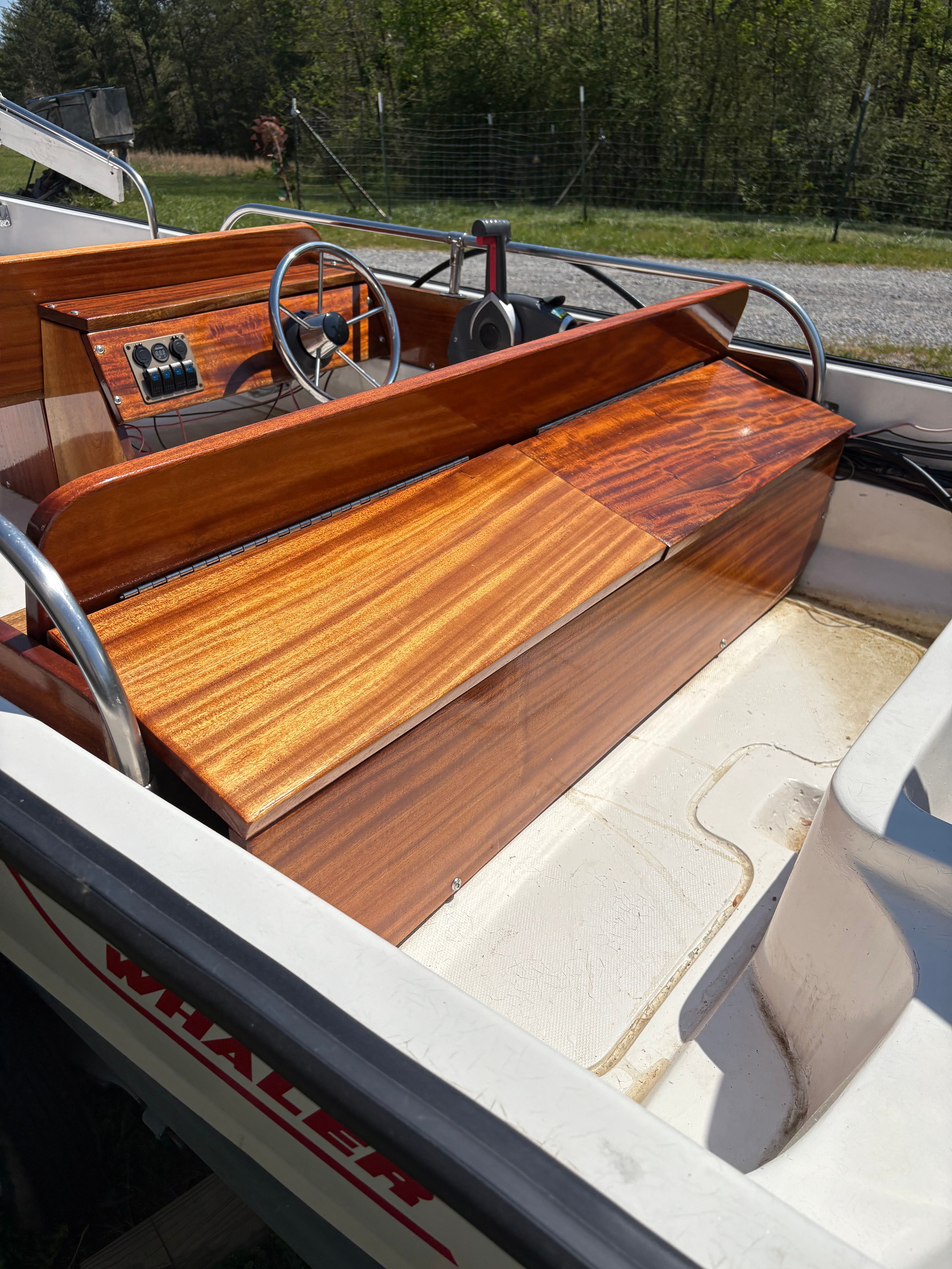 1977 Boston Whaler 13 with wooden console and steering wheel.