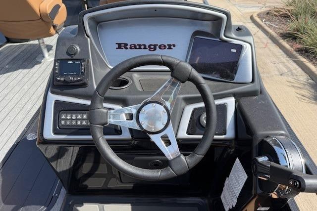 Steering console of 2026 Ranger 223F boat with modern controls and dashboard.