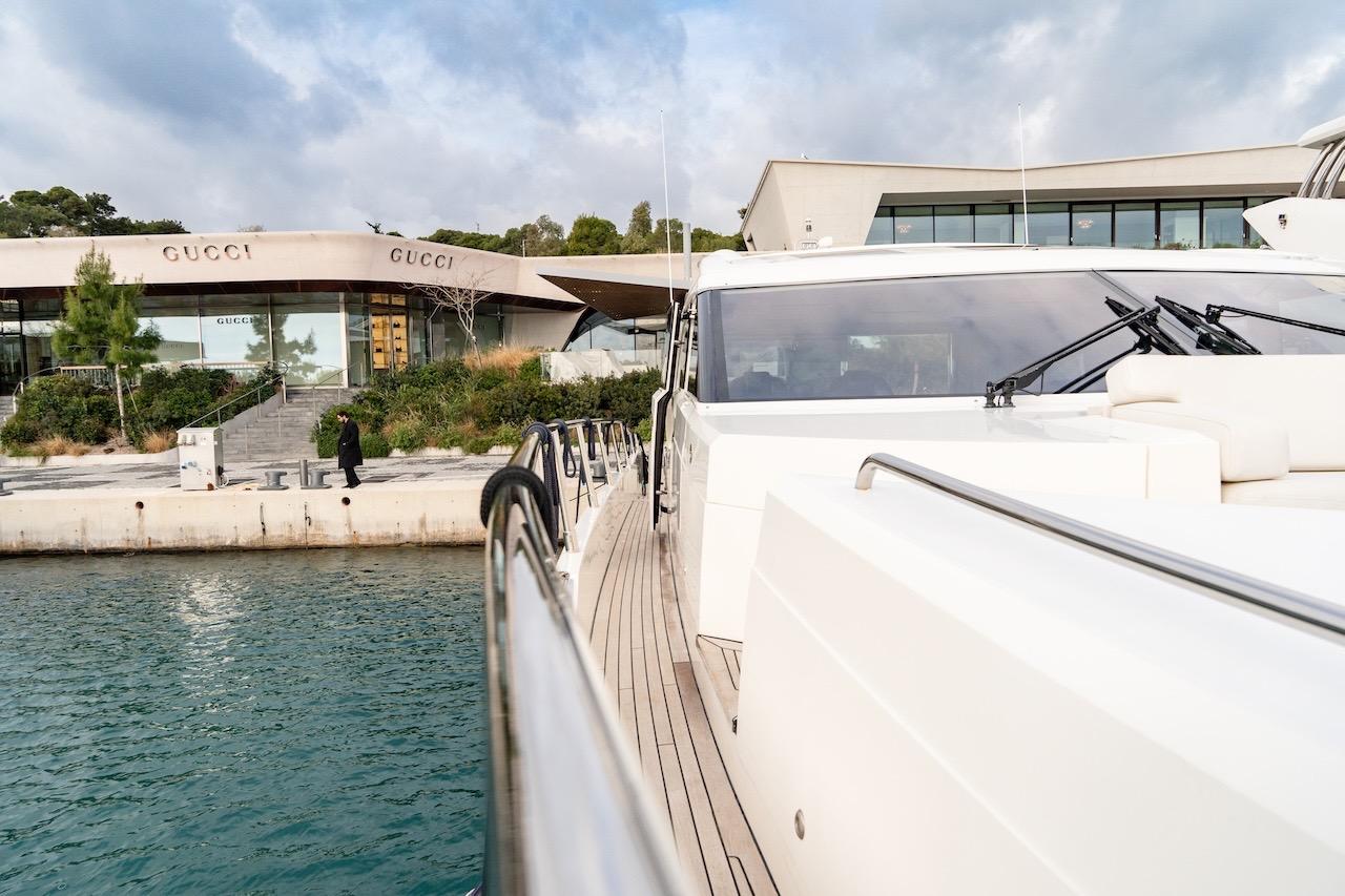 Luxury yacht Princess V72 docked near Gucci store, 2012 model.