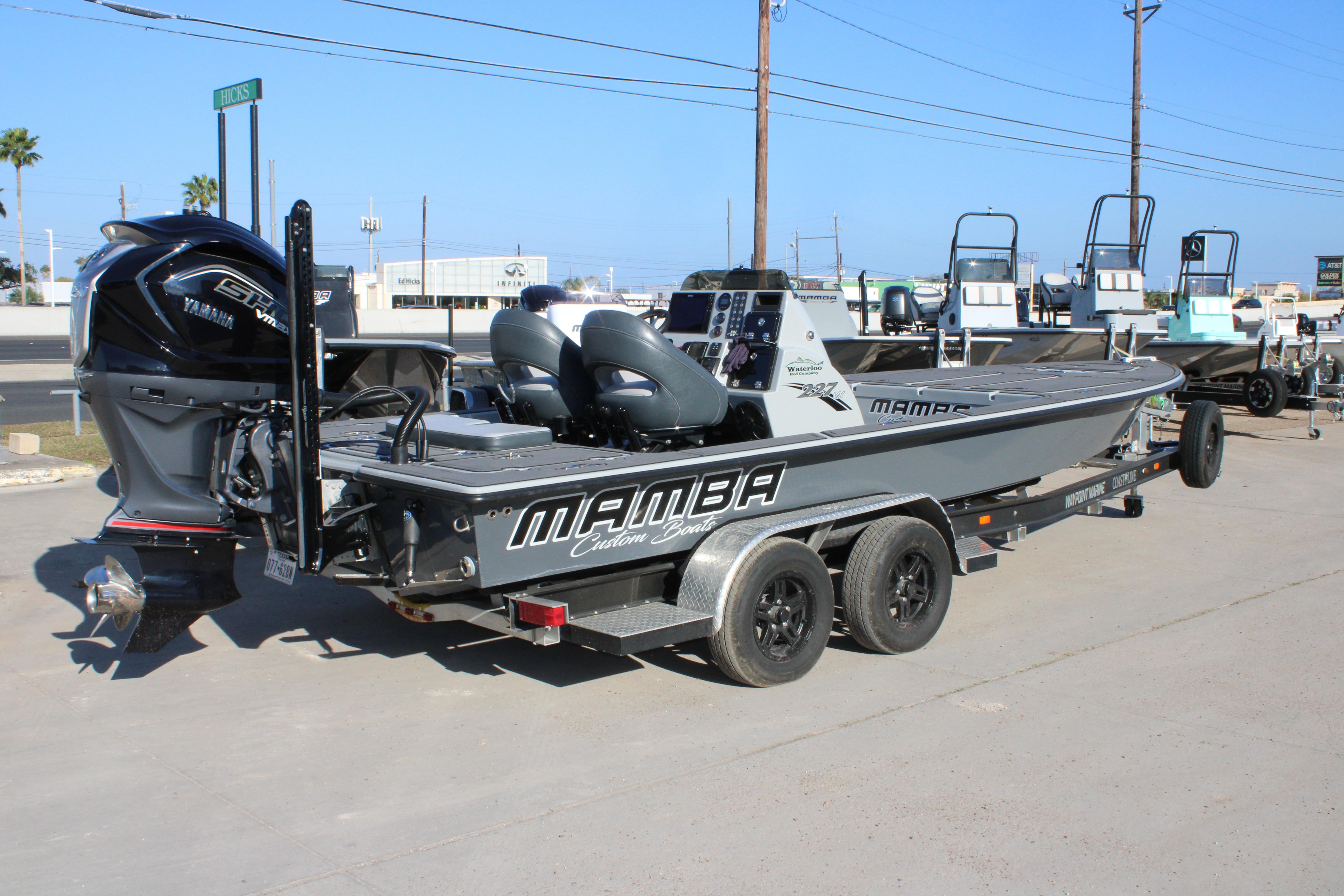 2025 Mamba 227VX boat on trailer, featuring Yamaha engine, parked outdoors.