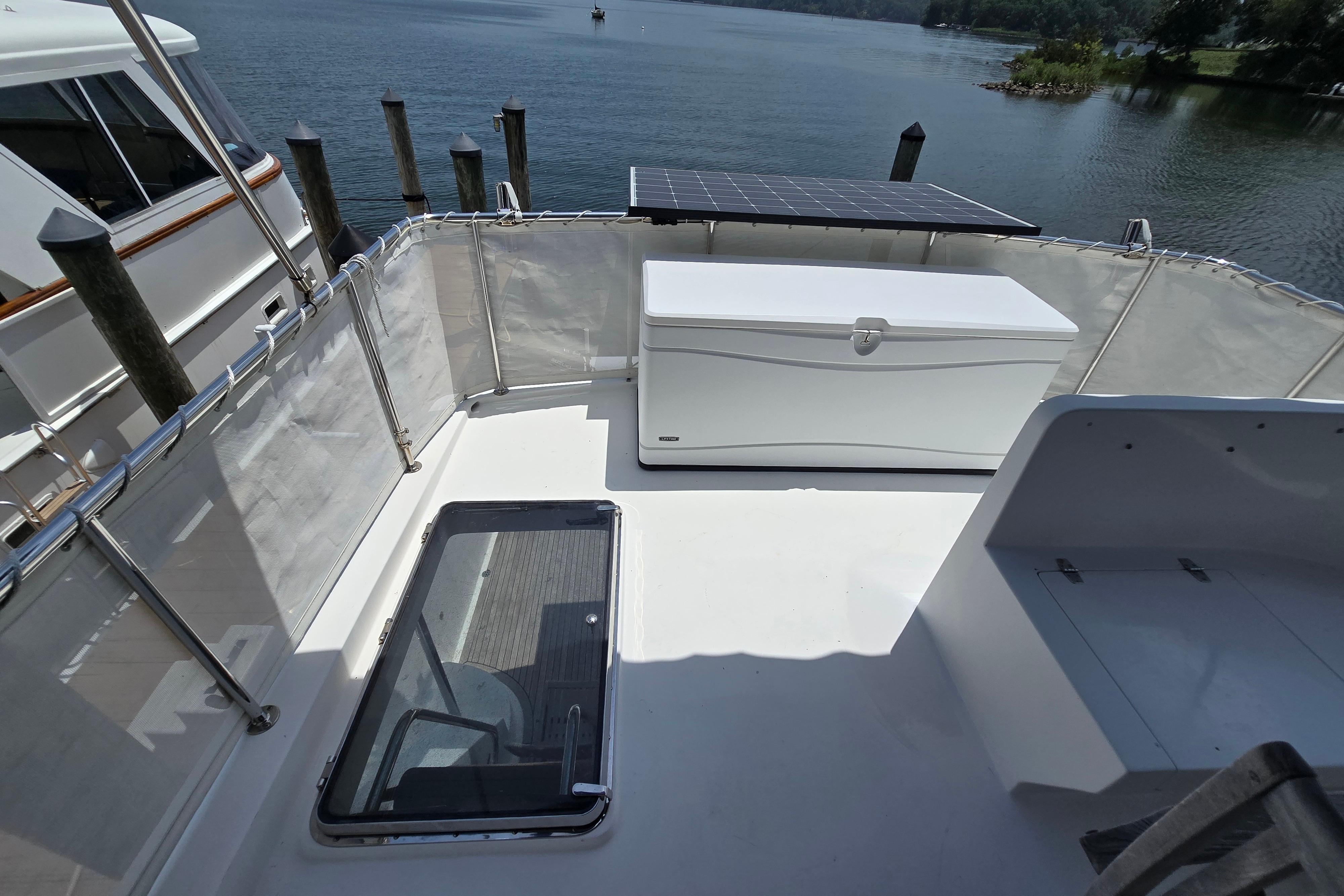 Deck of 2004 Grand Harbour 58 yacht with storage box and solar panel.