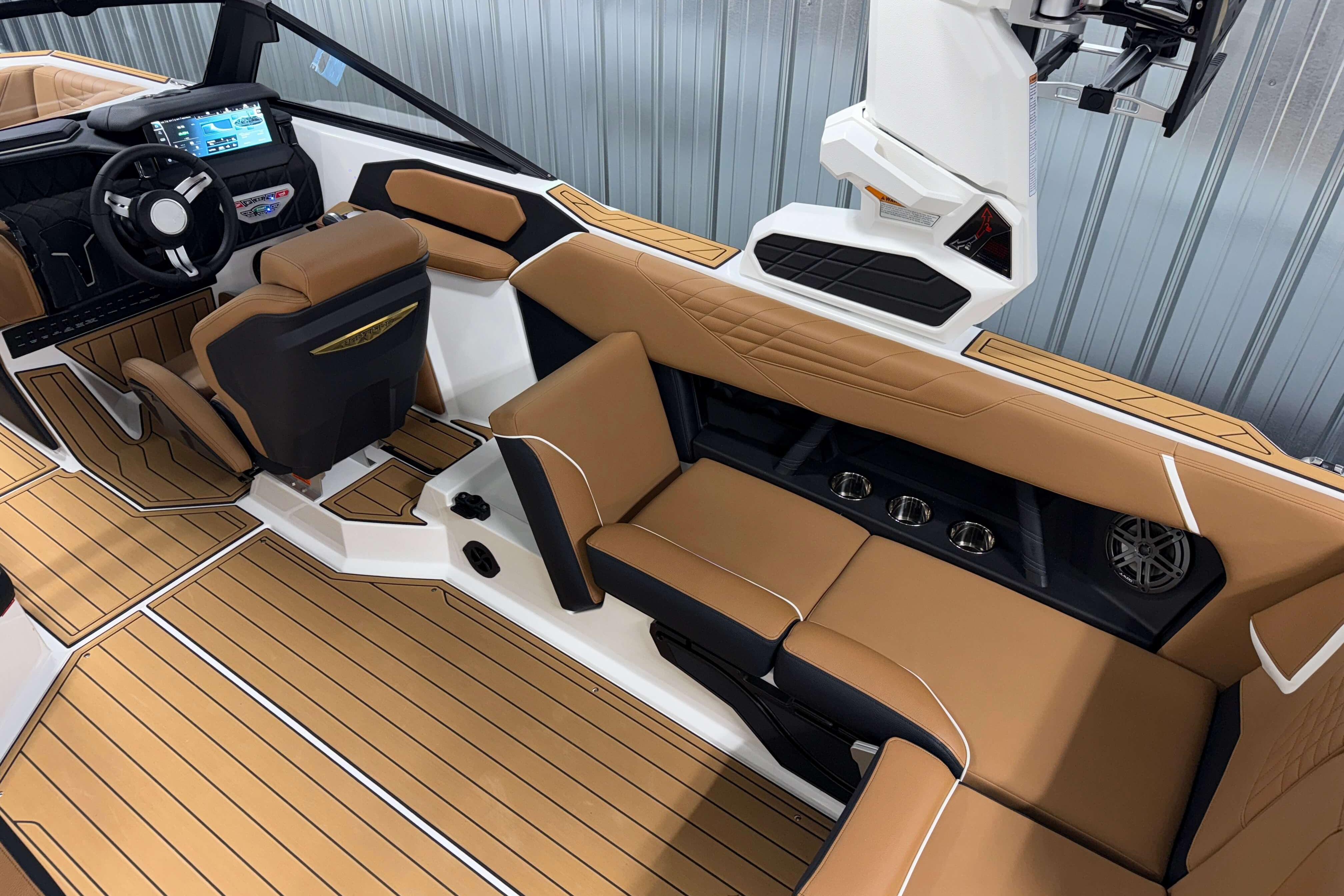 2026 Nautique Super Air Nautique S23 interior with tan seating and modern dashboard.