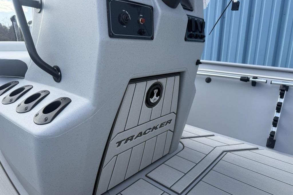 2026 Tracker Bass Tracker Classic CC boat console with rod holders and control panel.