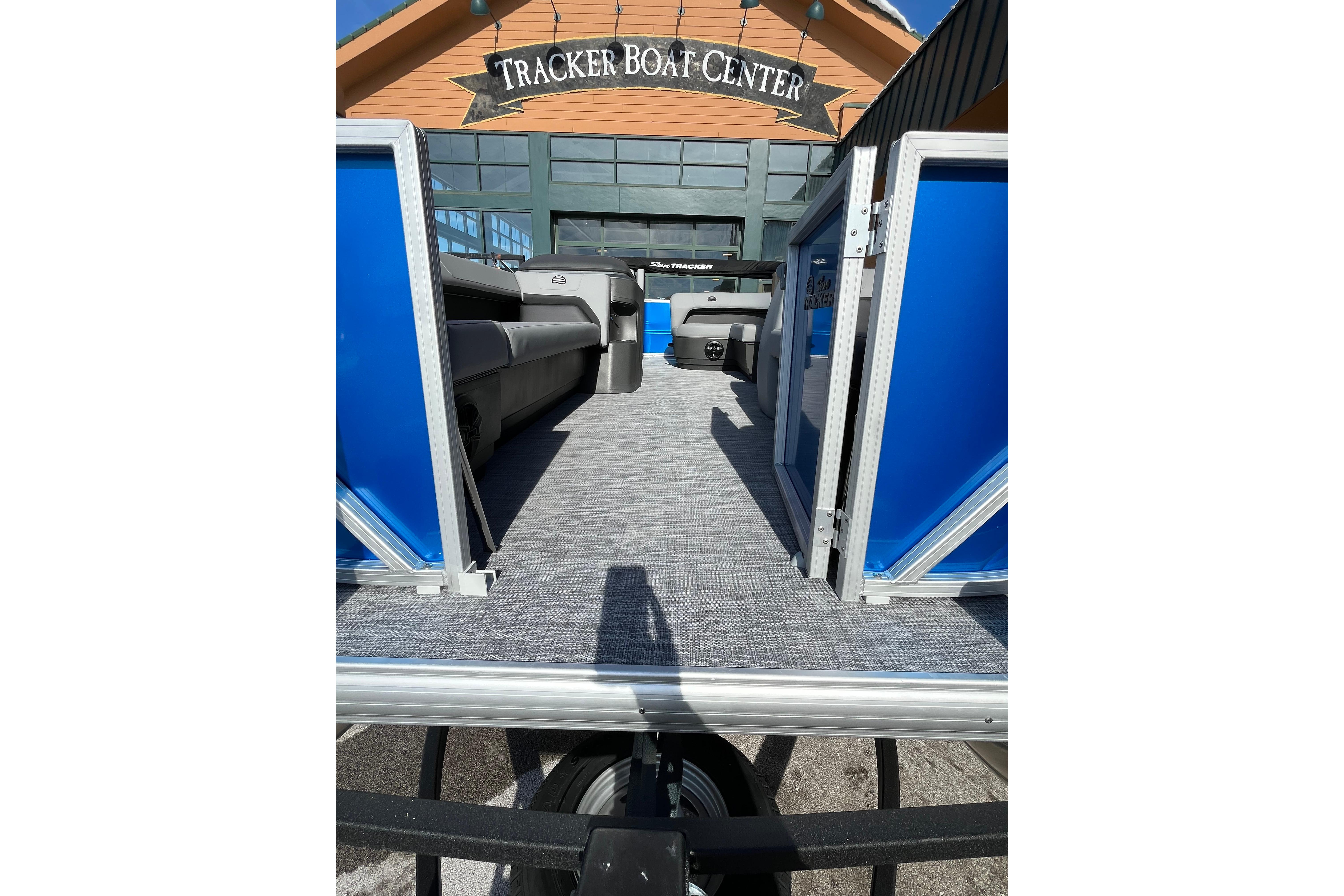2026 Sun Tracker Party Barge 18 DLX at Tracker Boat Center, showcasing interior seating.