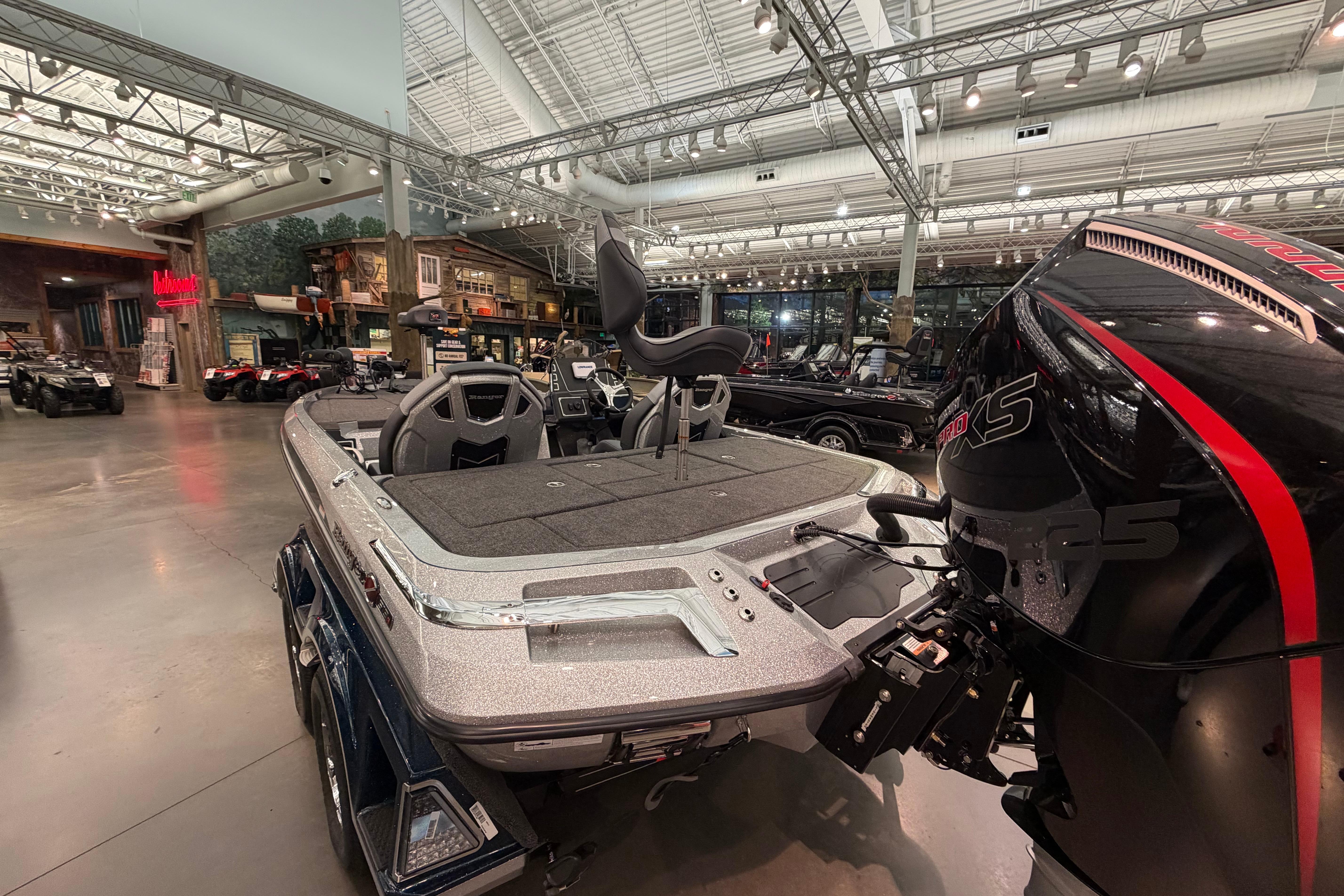 2026 Ranger Z519R boat displayed indoors with powerful engine and sleek design.