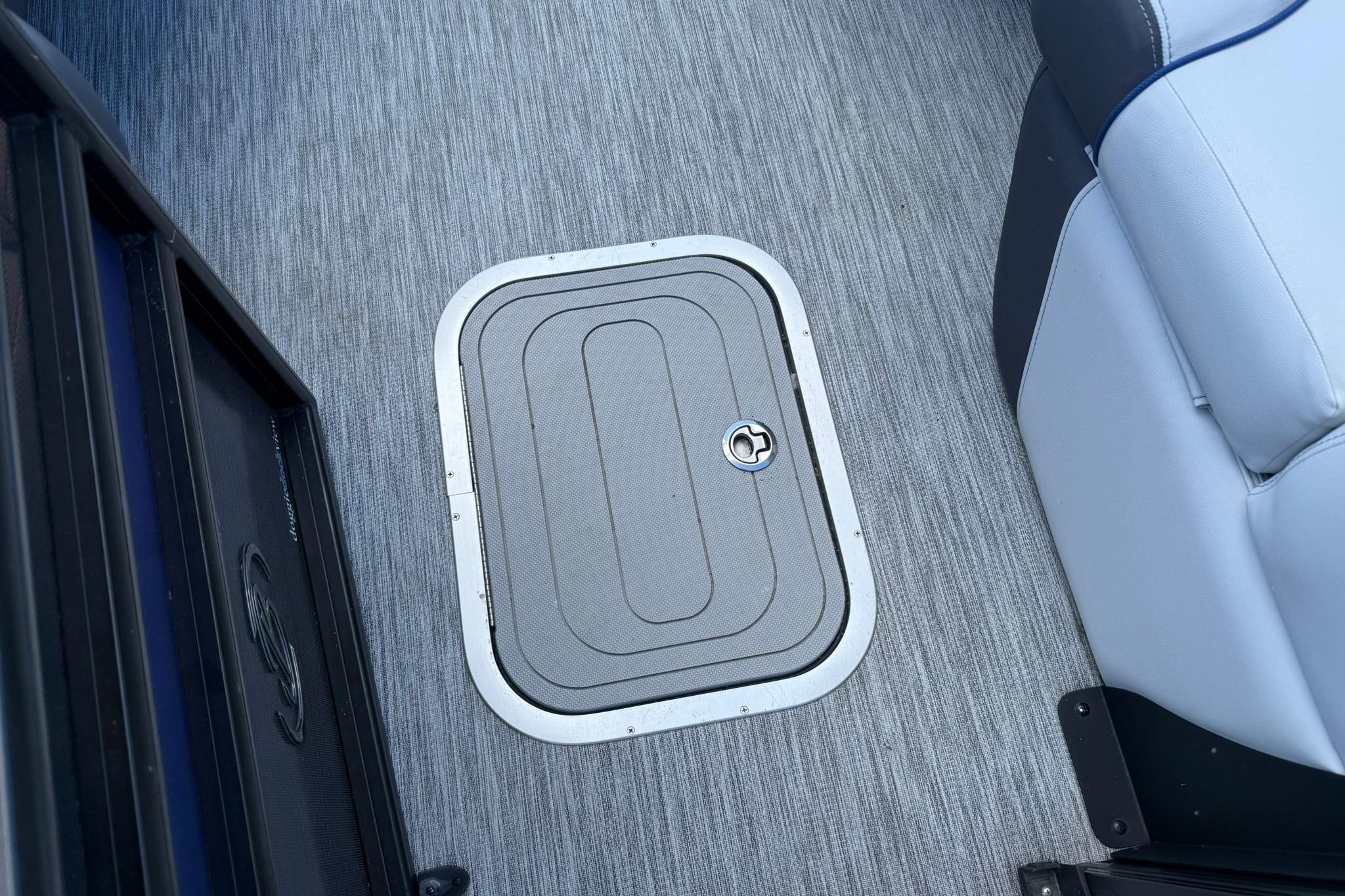 2023 Barletta Corsa 23U boat floor with storage hatch and seating.