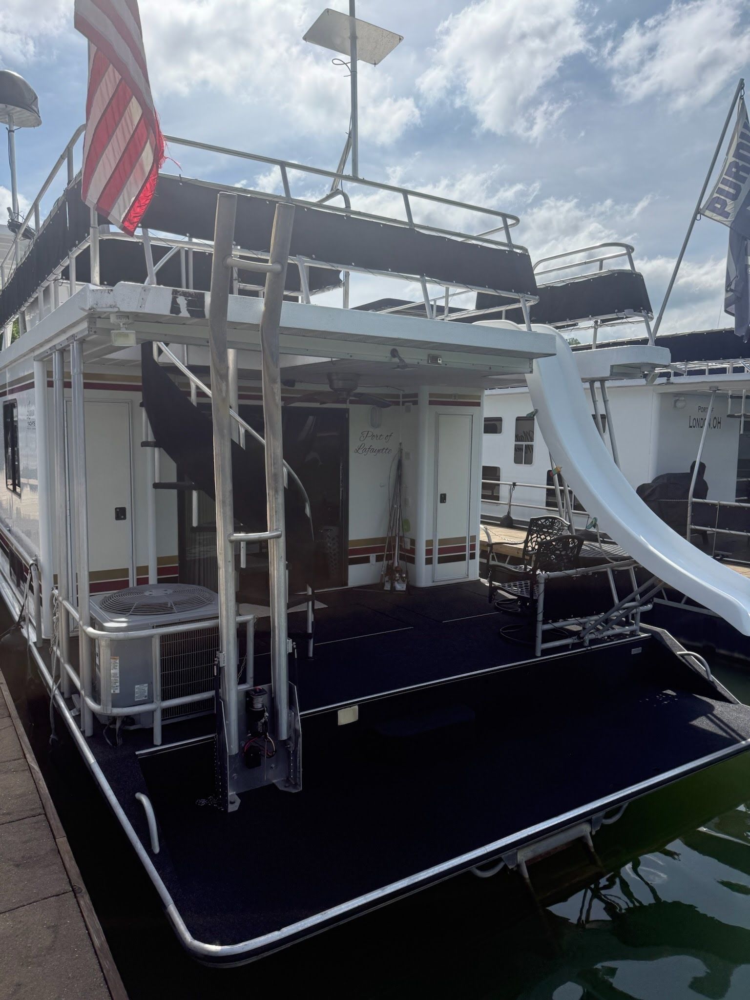 2003 Lakeview 16x70 houseboat with slide and sundeck.