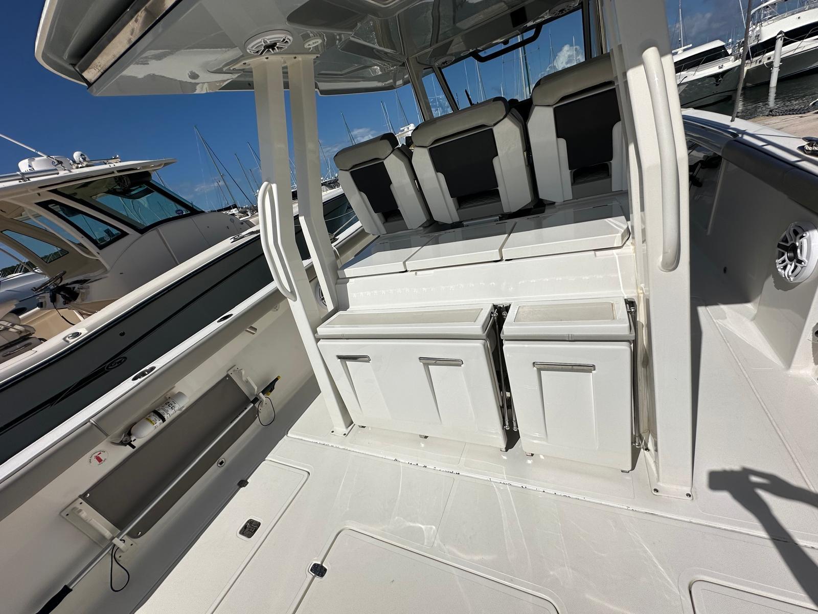 2023 Pursuit S 358 Sport boat interior with seating and storage compartments.