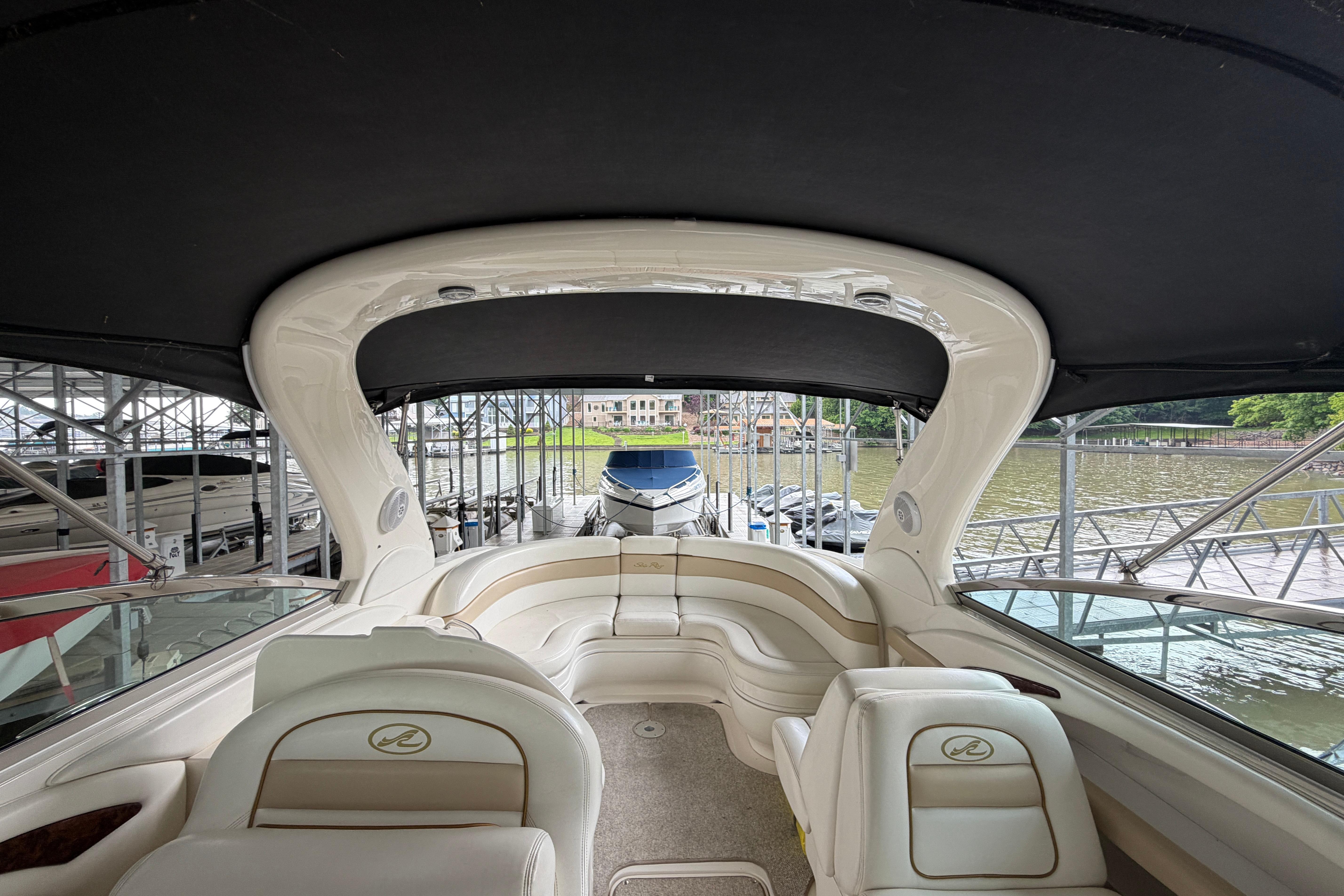 2003 Sea Ray 290 Bowrider interior with seating, docked at marina.