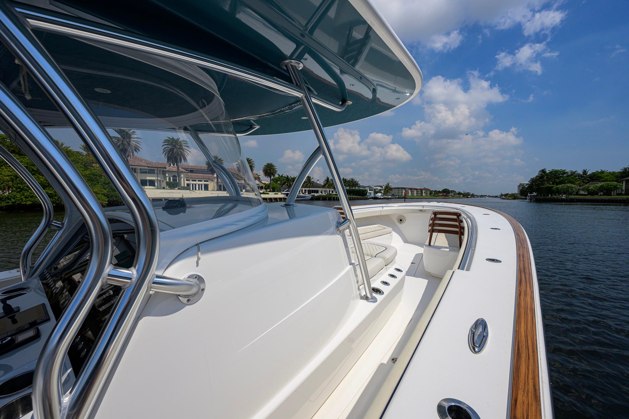 2020 Valhalla Boatworks V-41 on a sunny day, showcasing sleek design and waterfront view.