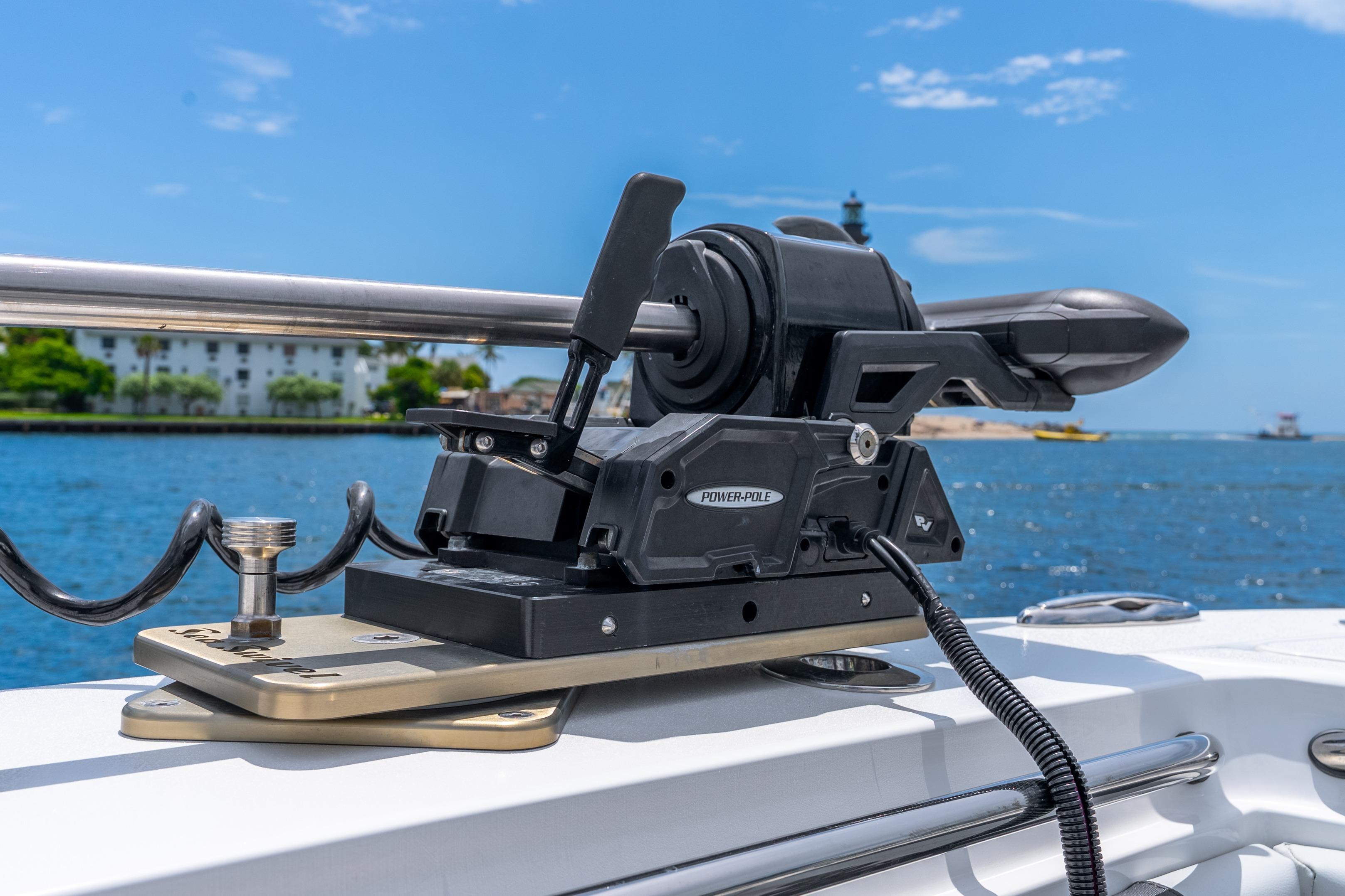 Power-Pole anchor system on 2024 Nor-Tech 452 Super Fish boat, with scenic waterfront view.