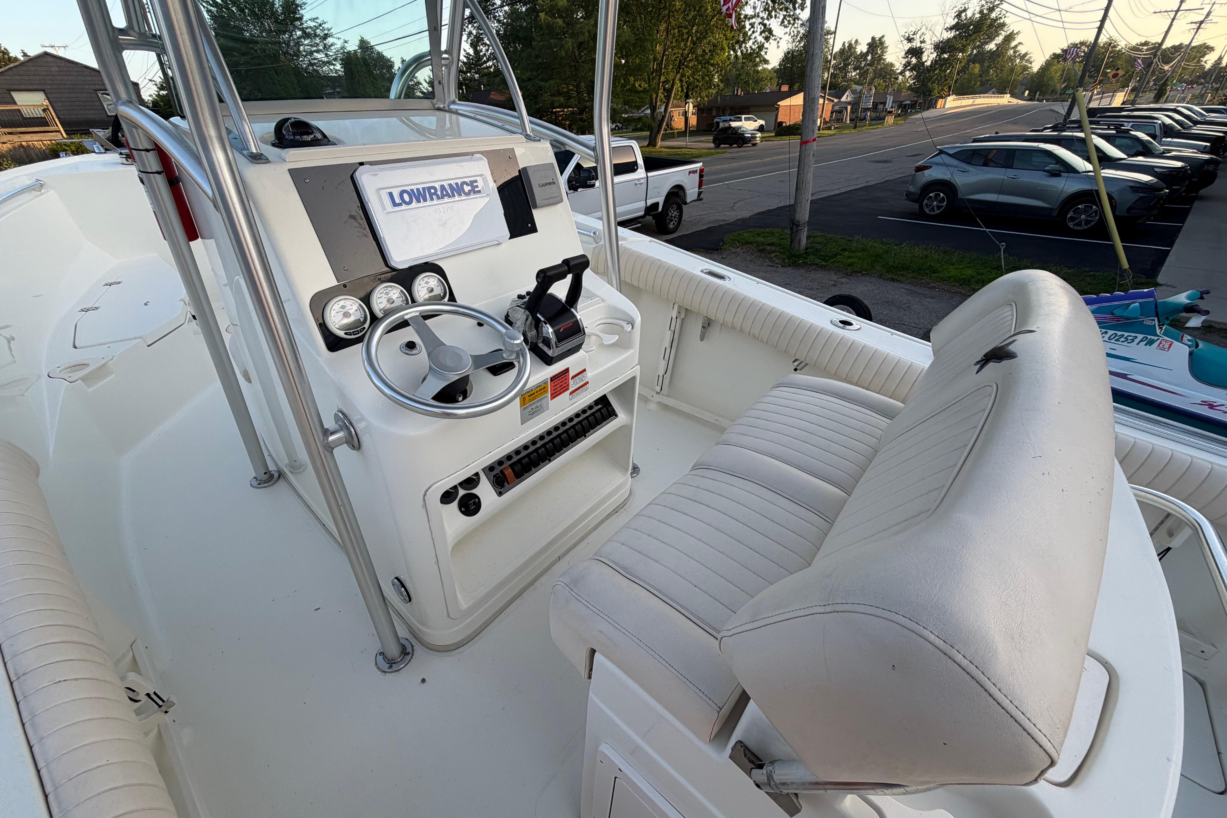2007 Mako 234 Center Console boat interior with steering wheel and seating.