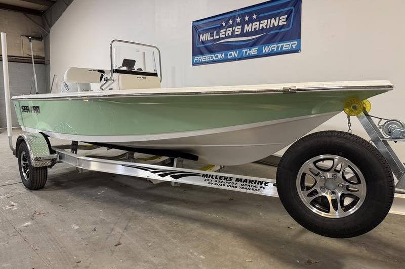 2026 Sea Pro 172 Bay boat on trailer at Miller's Marine showroom.