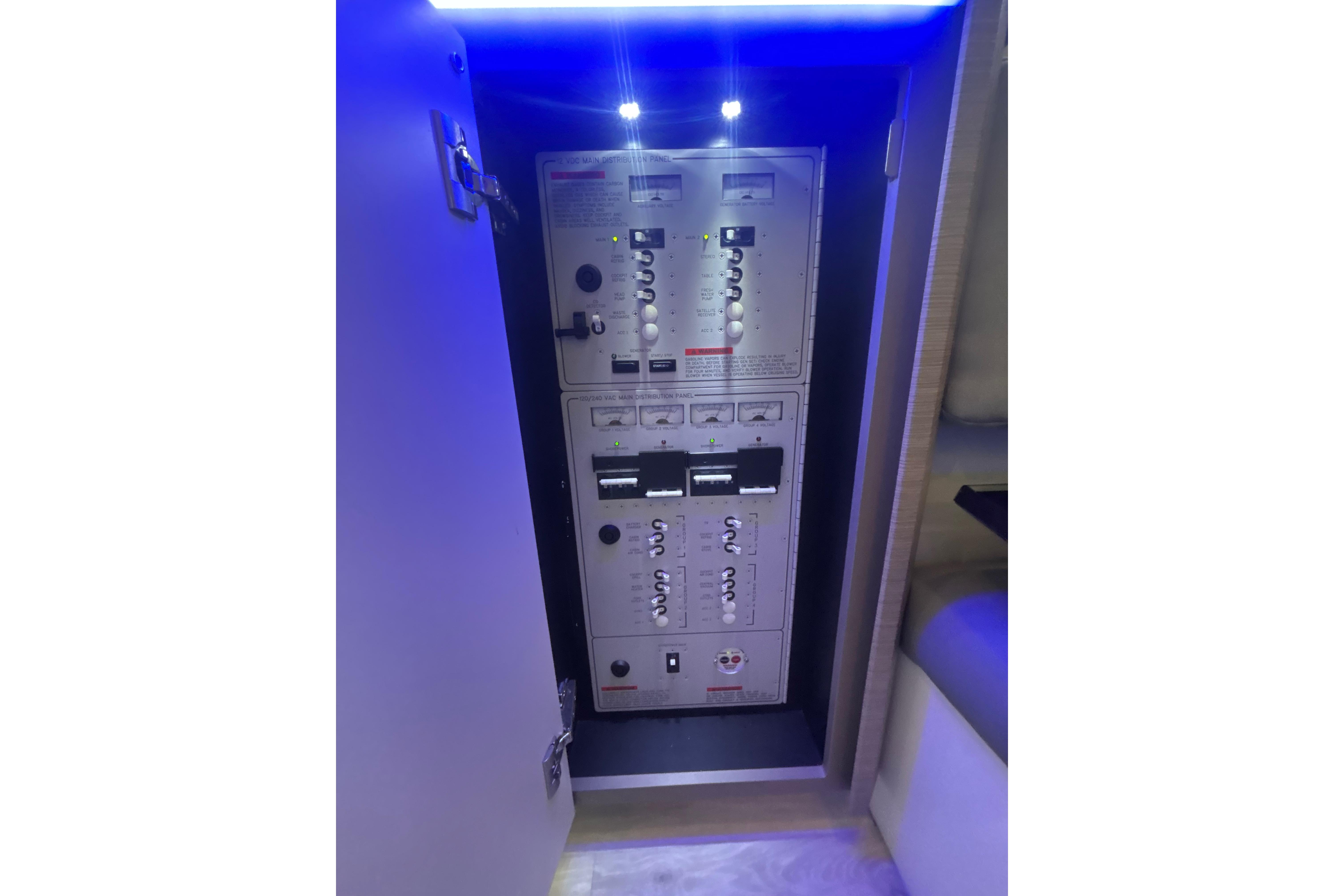 Control panel inside 2019 Formula 430 Super Sport Crossover boat, illuminated by blue LED lights.