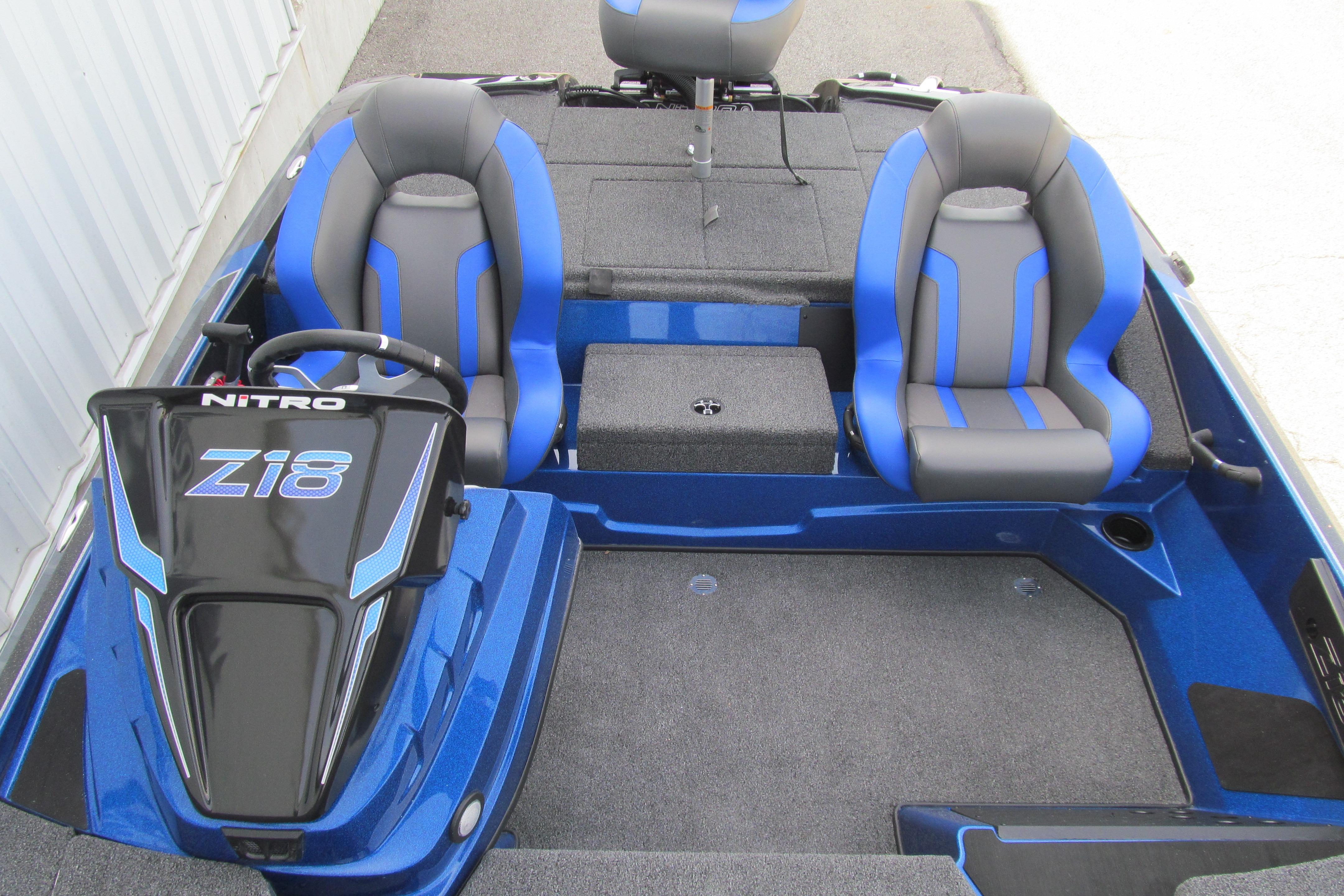 2026 Nitro Z18 Pro boat interior with blue and gray seats, steering console.