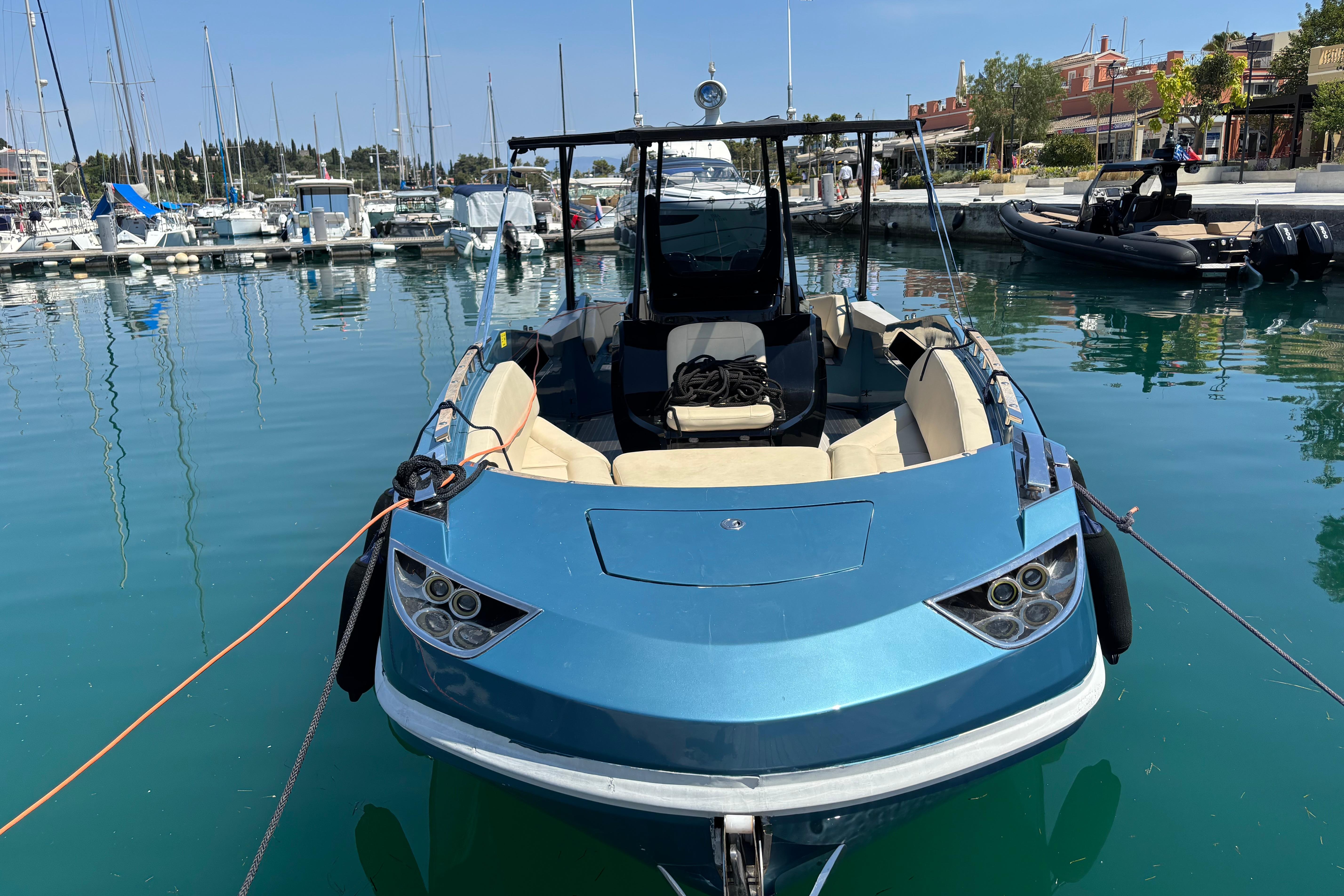 Blue Argo Navis 10GT boat docked in a marina, 2018 model.