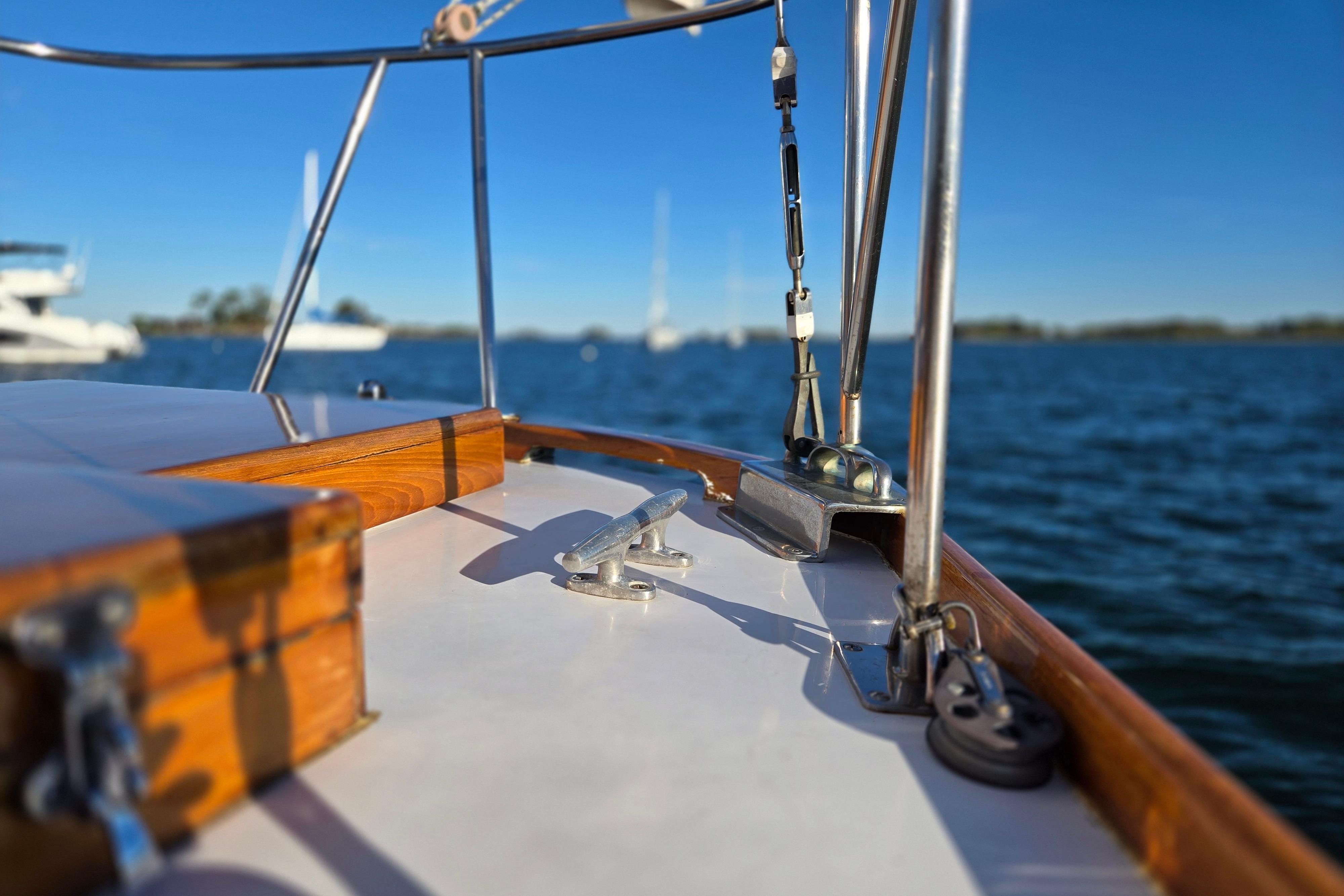 1970 Hinckley Bermuda 40 sailboat deck with ocean view and clear blue sky.