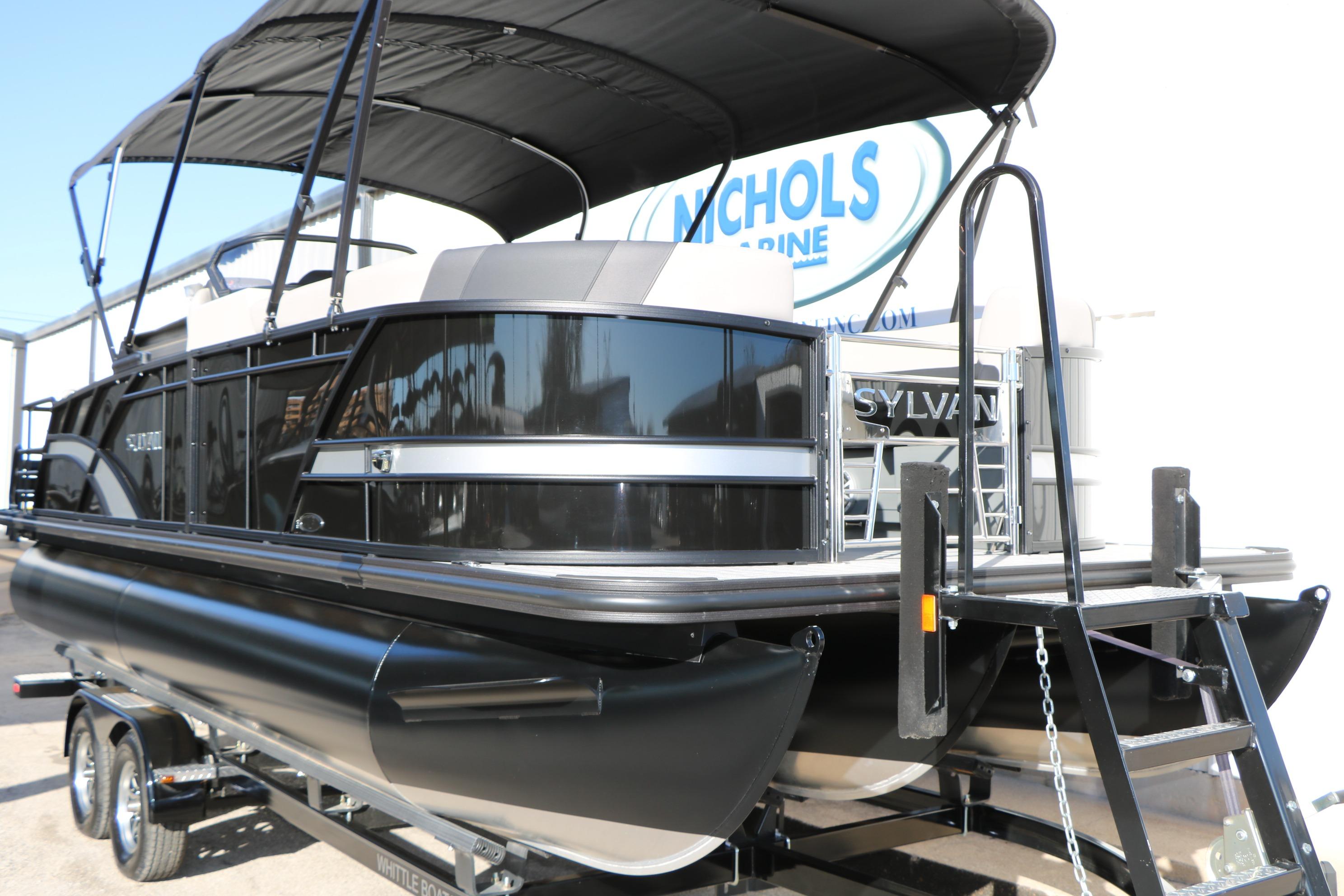 2026 Sylvan L3 CLZ DH pontoon boat with black exterior and canopy on trailer.