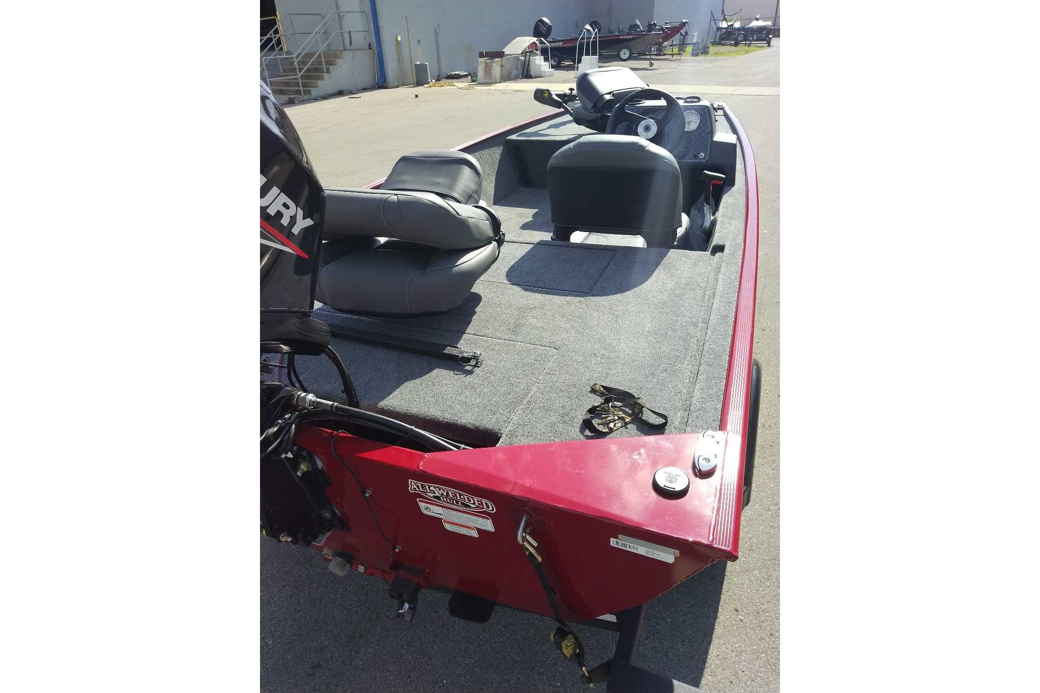 2026 Tracker Bass Tracker Classic XL boat with gray seating and red exterior.