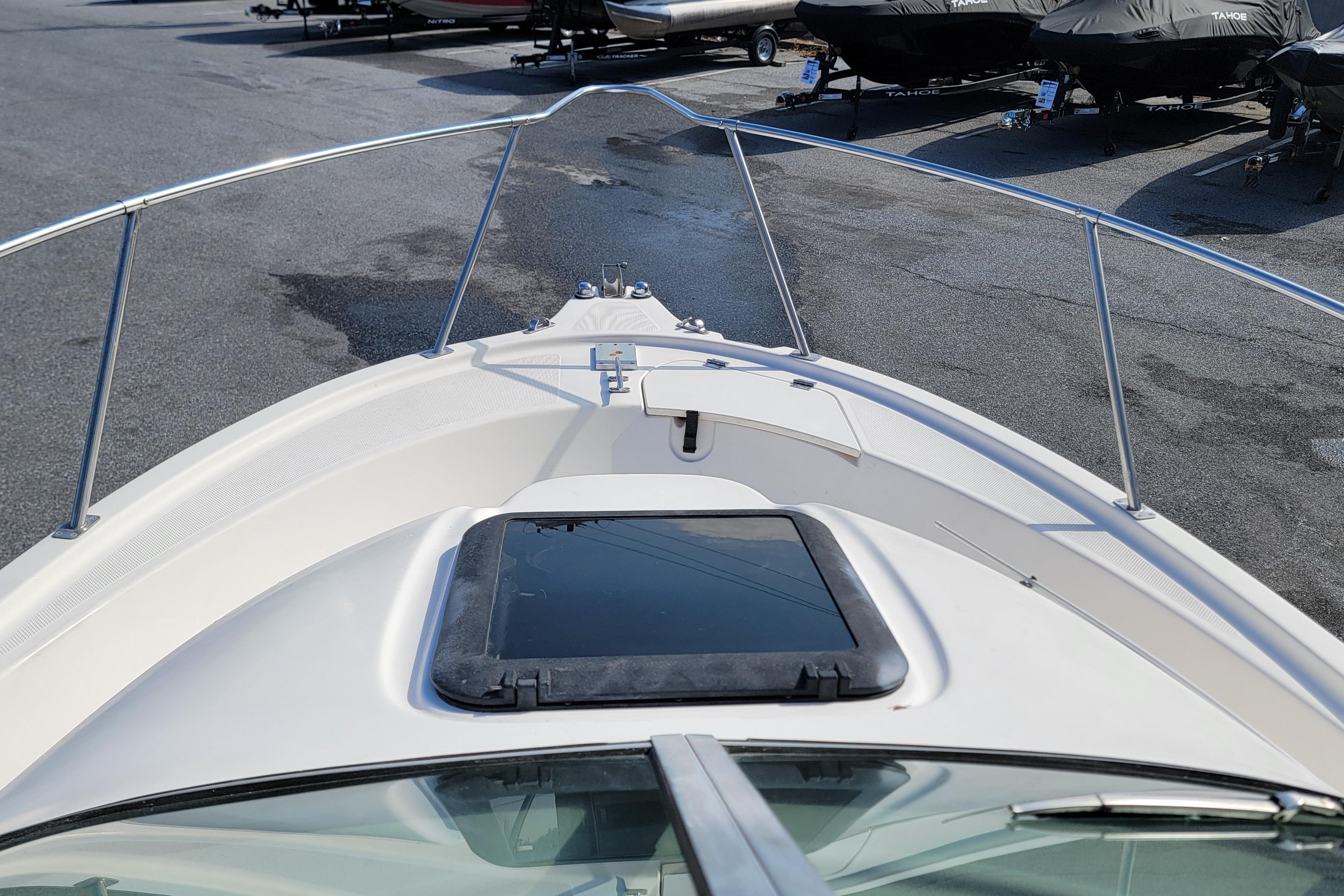 2003 Trophy 2002 Walkaround boat bow view in a marina setting.