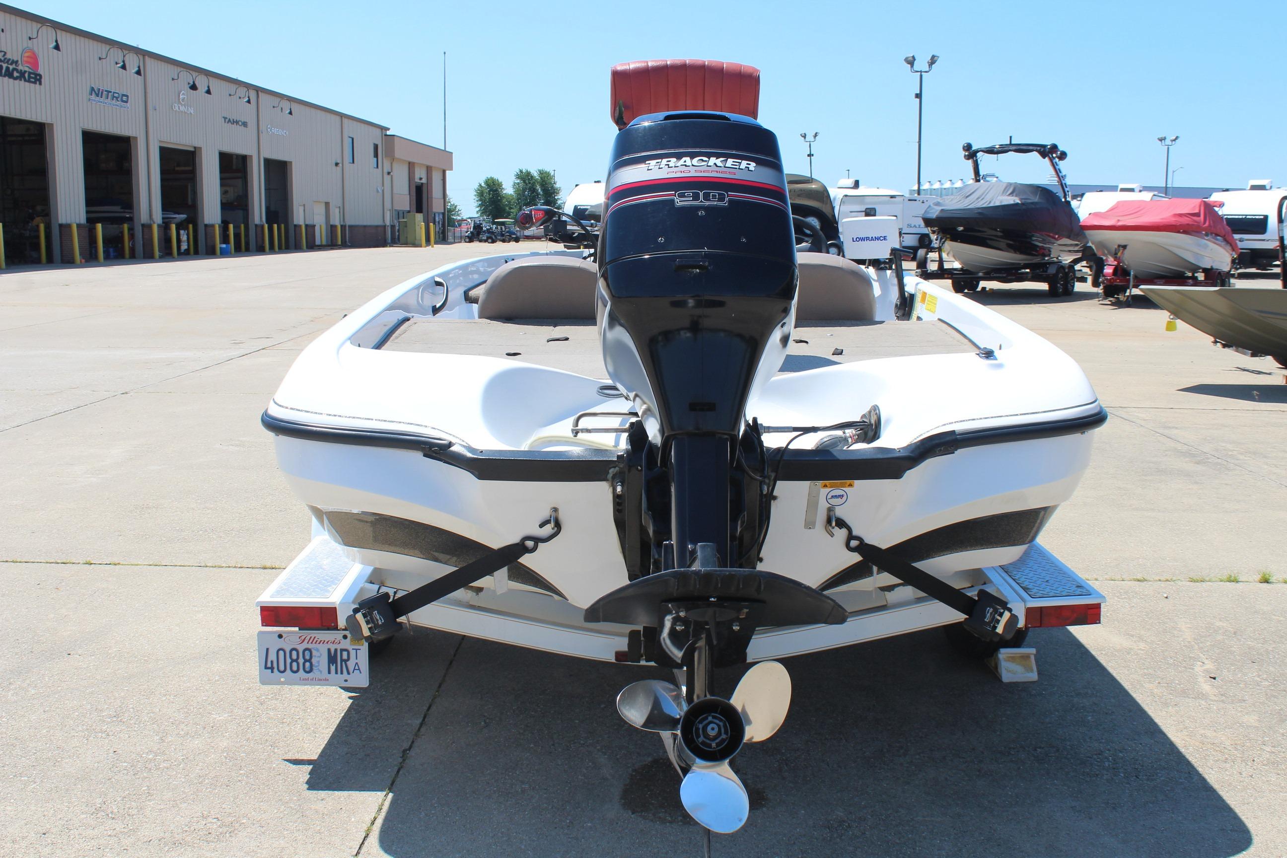2003 Nitro NX 750 SC boat with Tracker engine, parked at a marina.