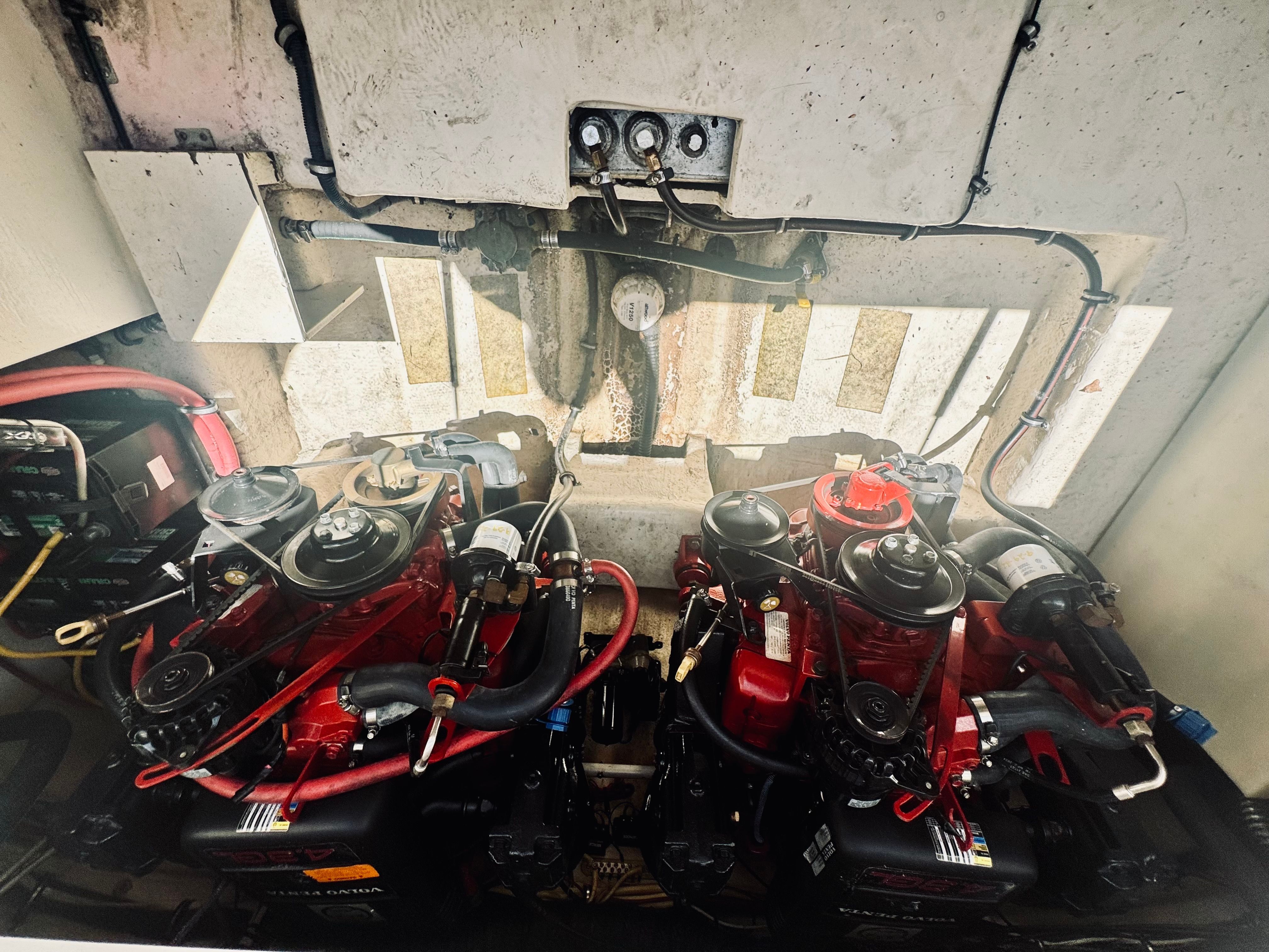 Engine compartment of a 2005 Chaparral Signature 270 boat with dual engines.