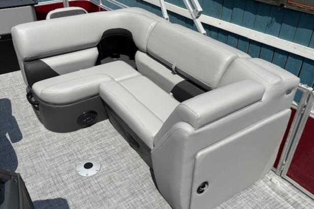 Luxurious seating on 2026 Sun Tracker SportFish 20 DLX pontoon boat, featuring sleek gray upholstery.