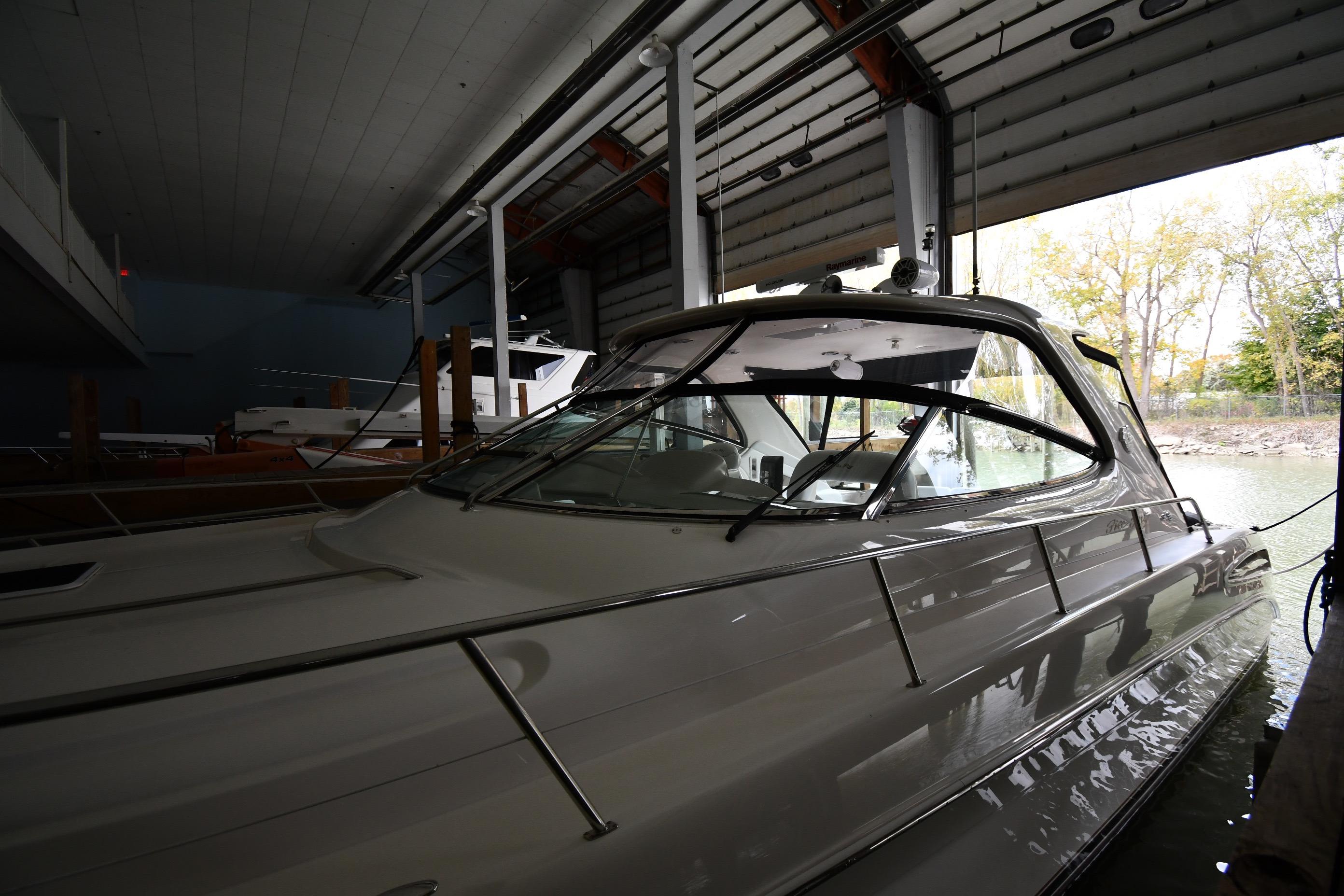 2001 Sea Ray 540 Sundancer yacht docked in a covered marina.