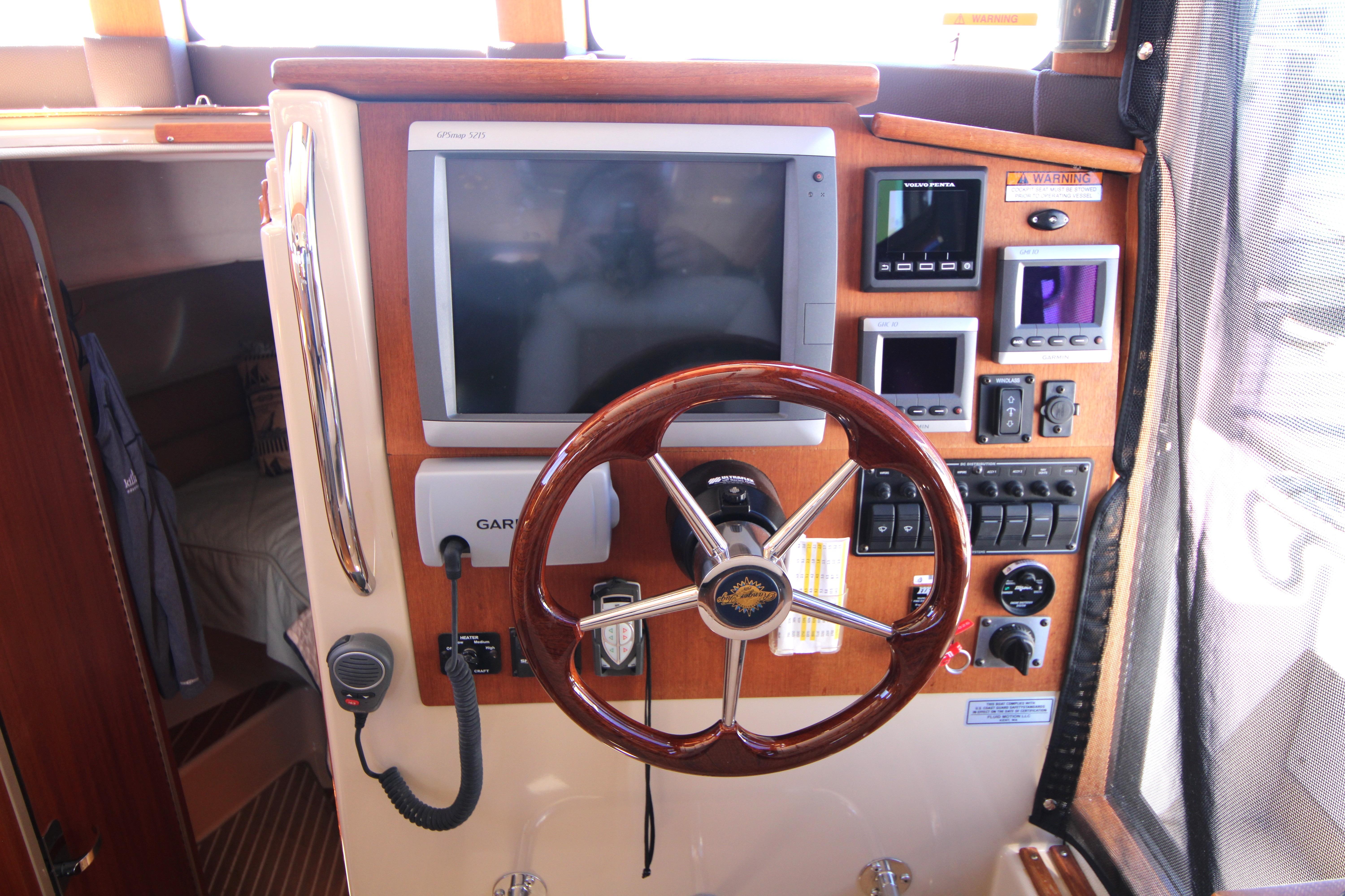 2013 Ranger Tugs R-31 CB helm with Garmin navigation and control panels.