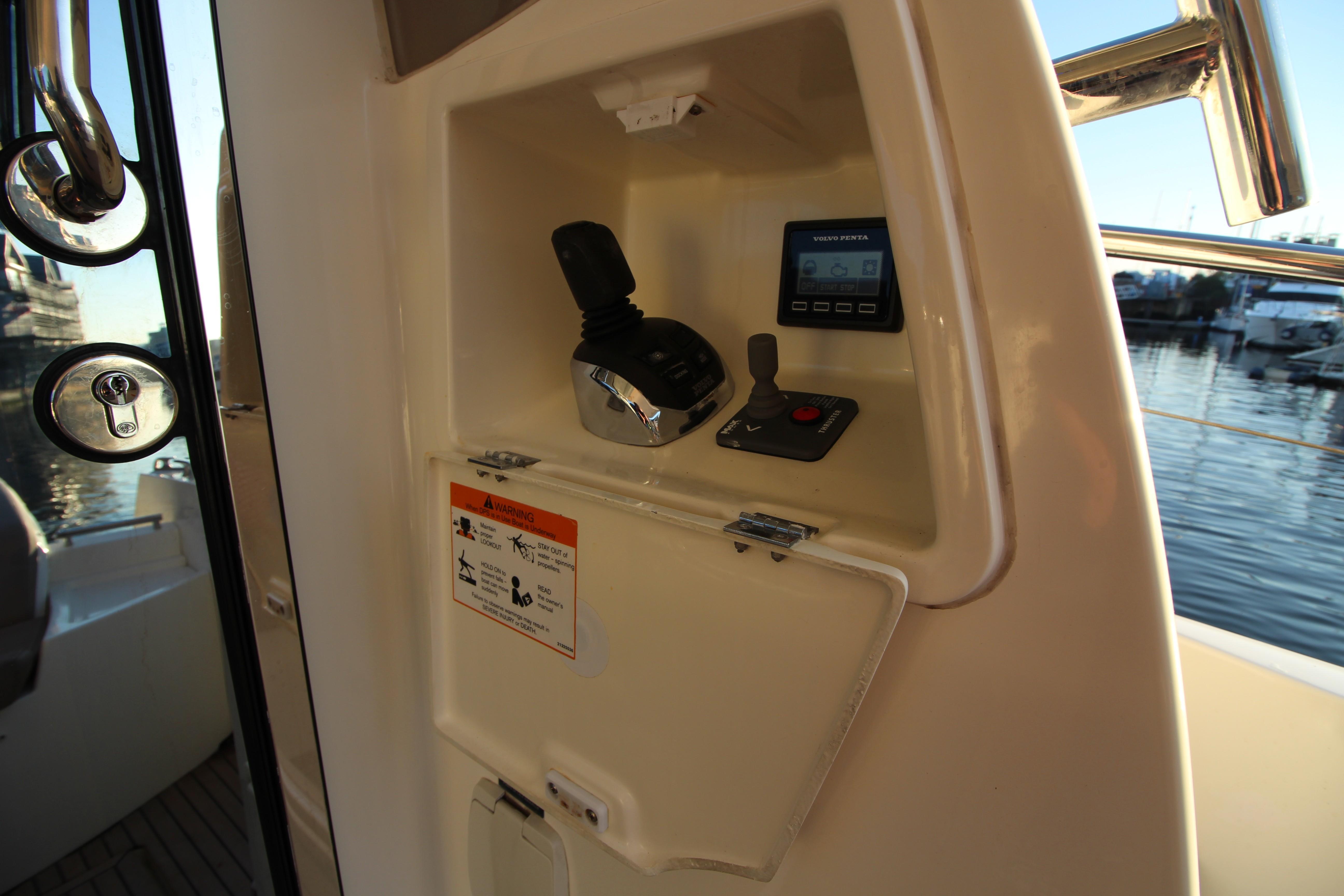 Control panel of a 2017 Prestige 500 yacht, featuring throttle and display.