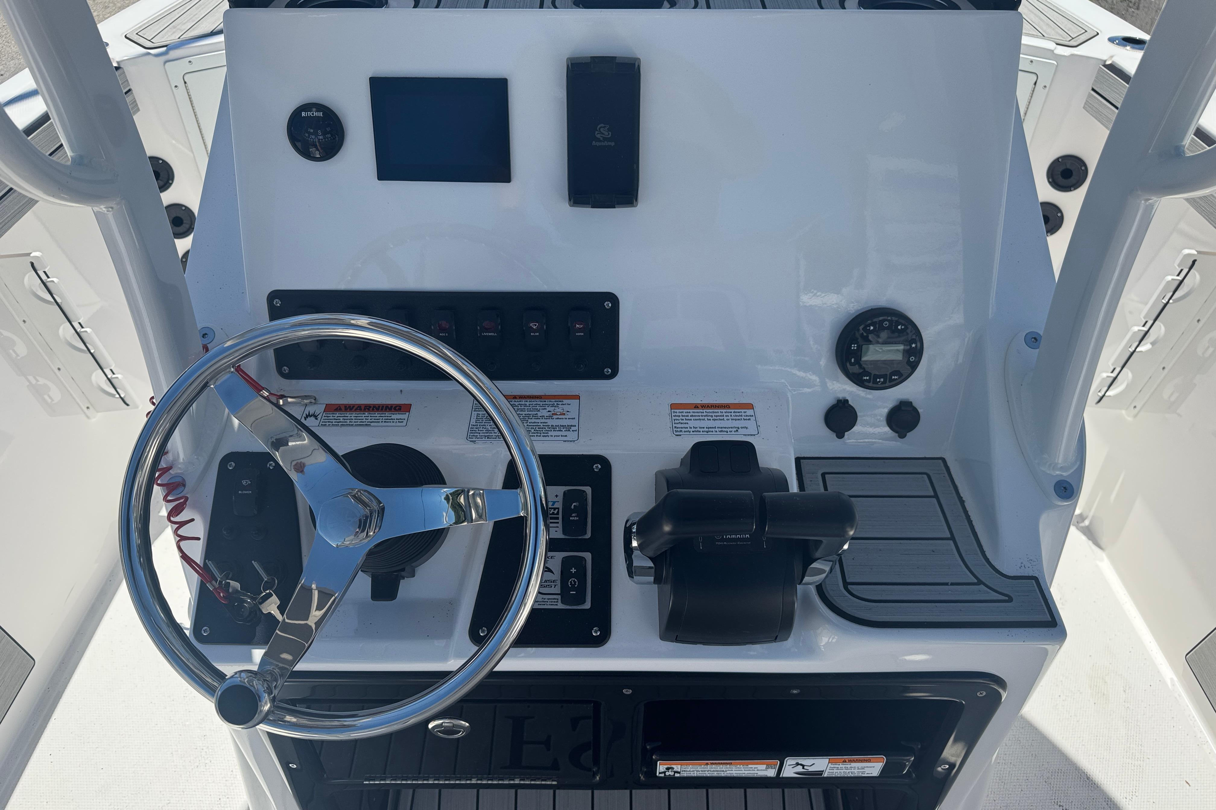 2026 Yamaha Boats 220 FSH Sport dashboard with steering wheel and controls.