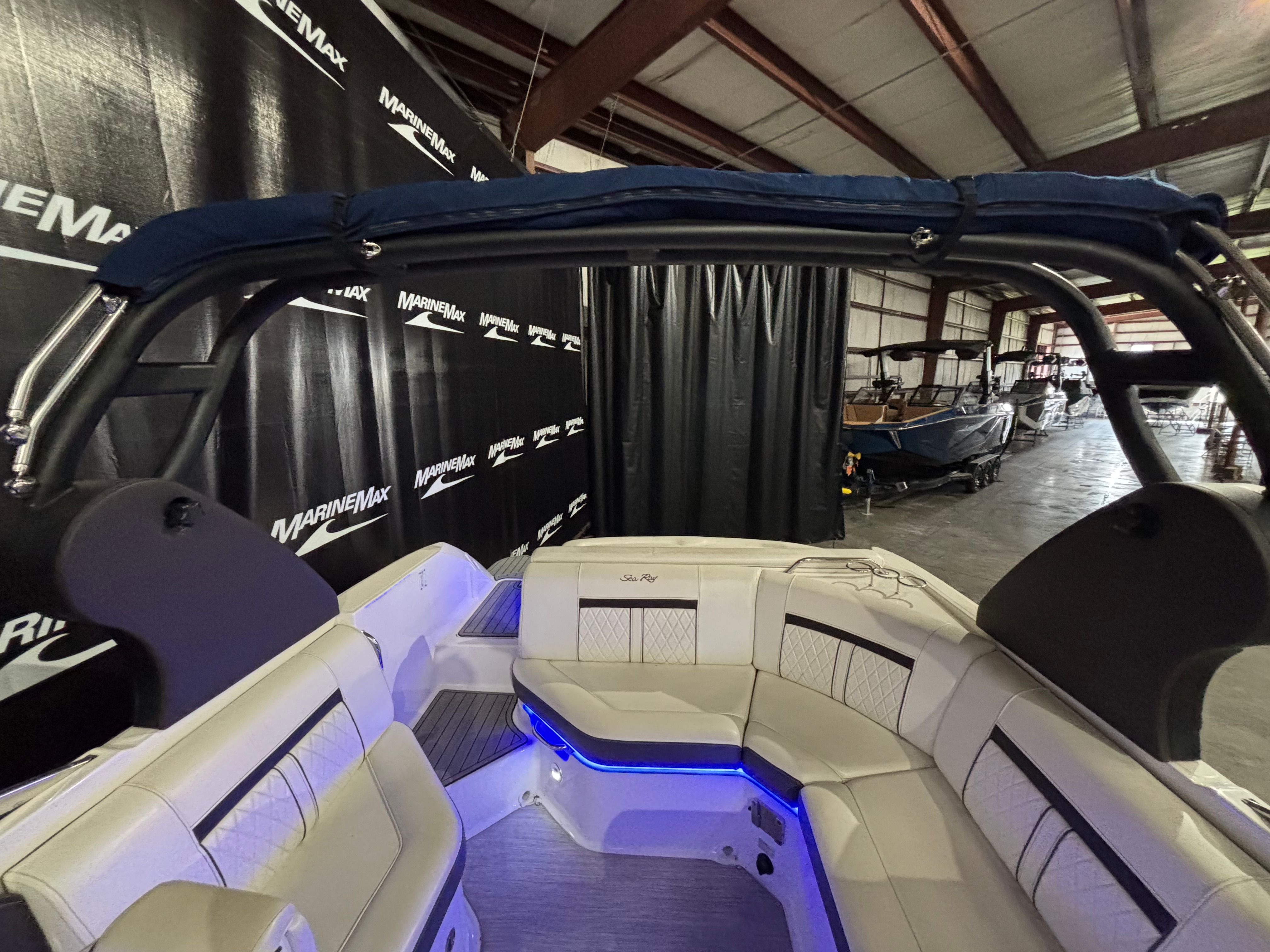 Interior of a 2018 Sea Ray SLX 230 boat with blue lighting.
