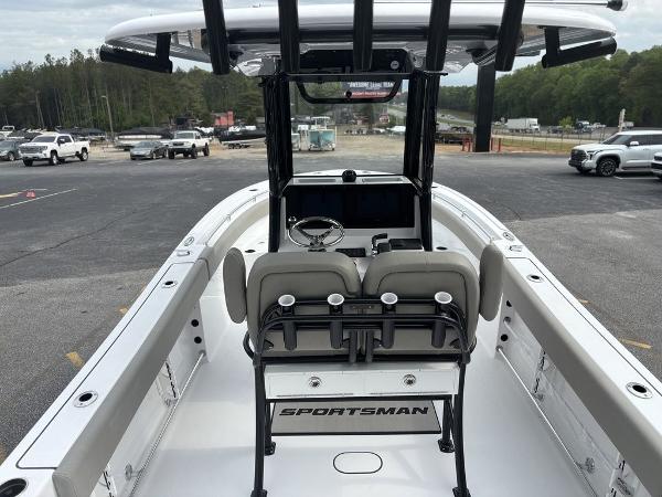 2025 Sportsman Open 232 boat interior with helm, parked in a lot.
