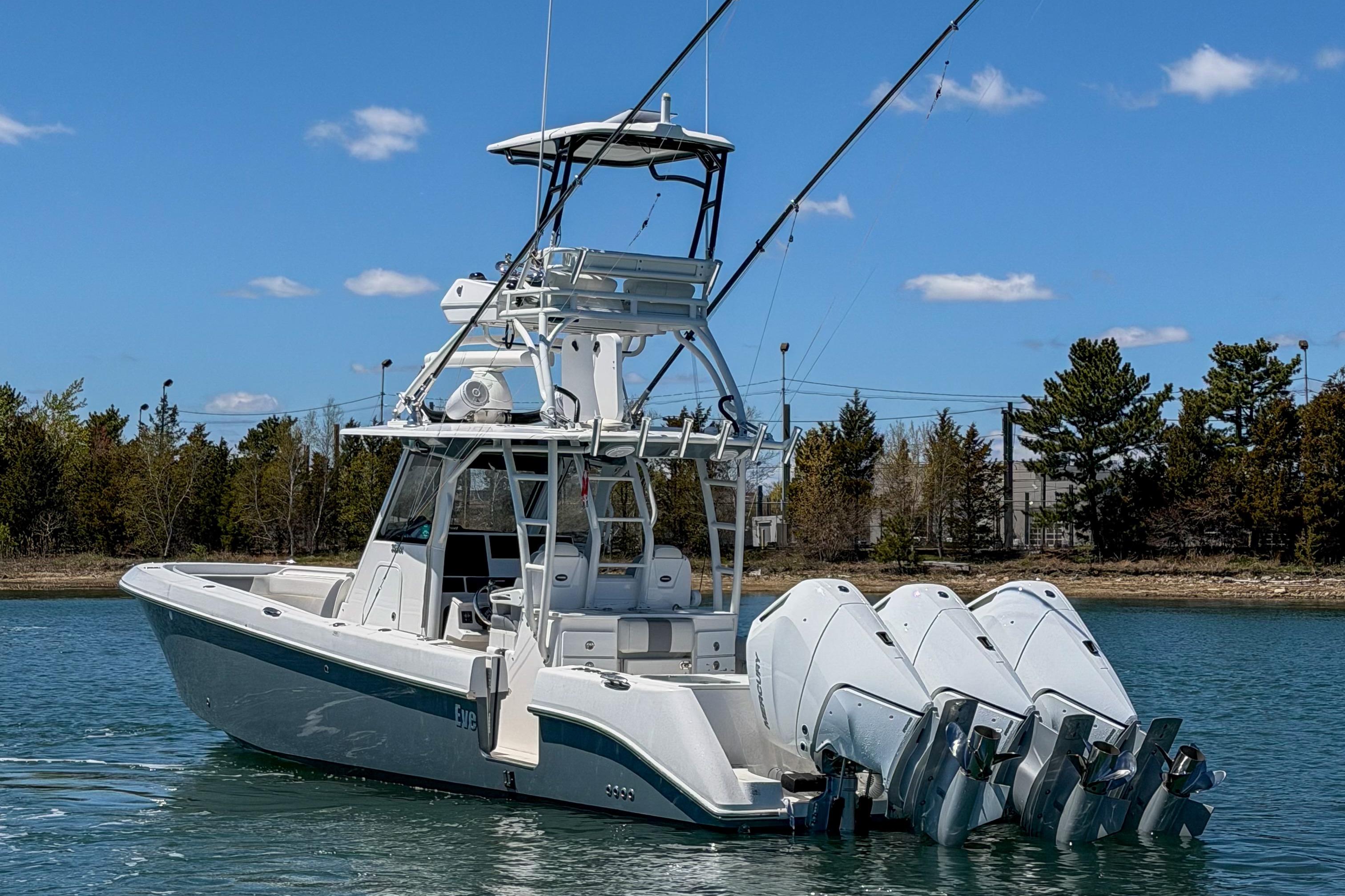 2017 Everglades 355 Center Console boat with four engines on a sunny day.