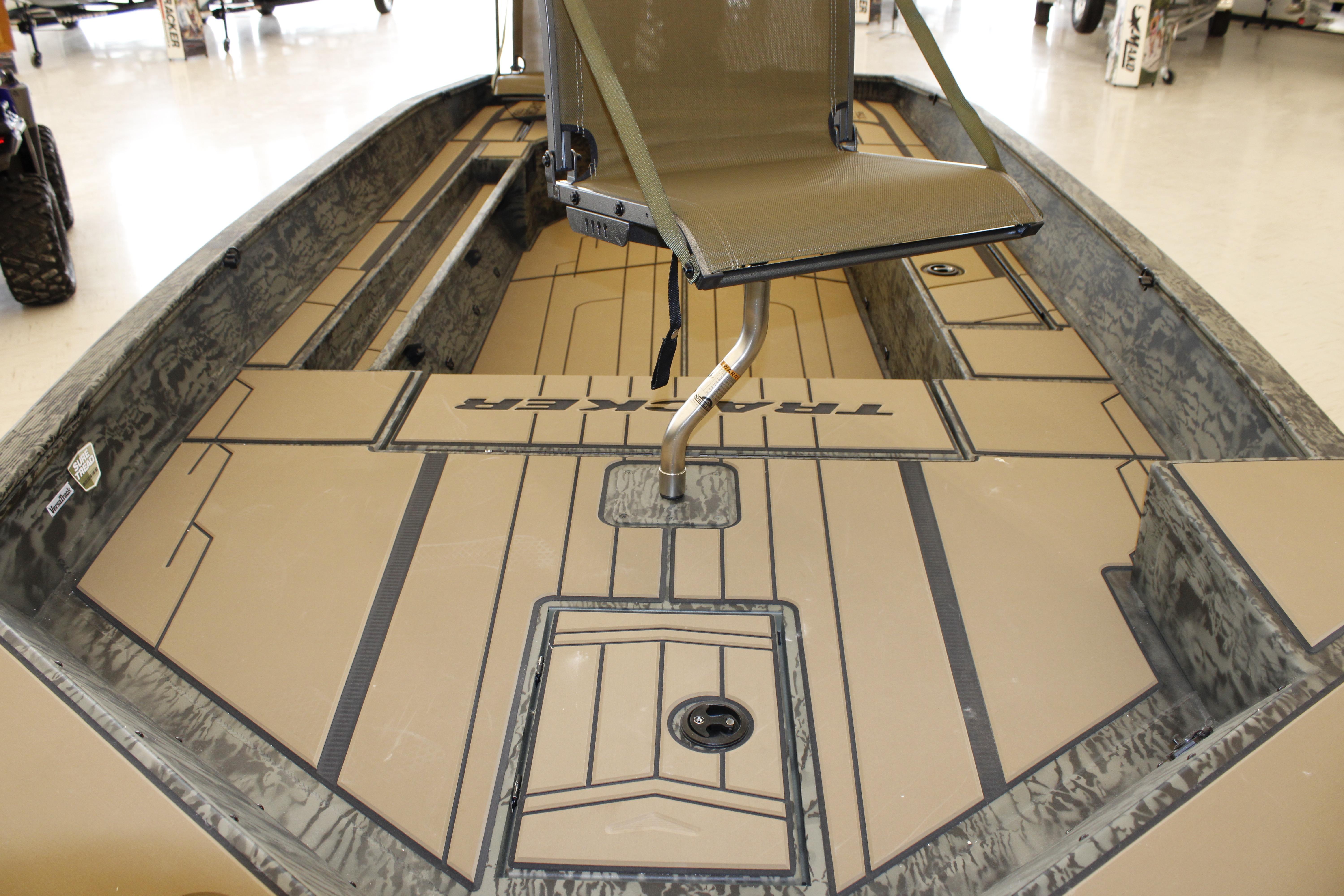 2026 Tracker Grizzly 1756 T Marsh boat interior with seating and storage compartments.