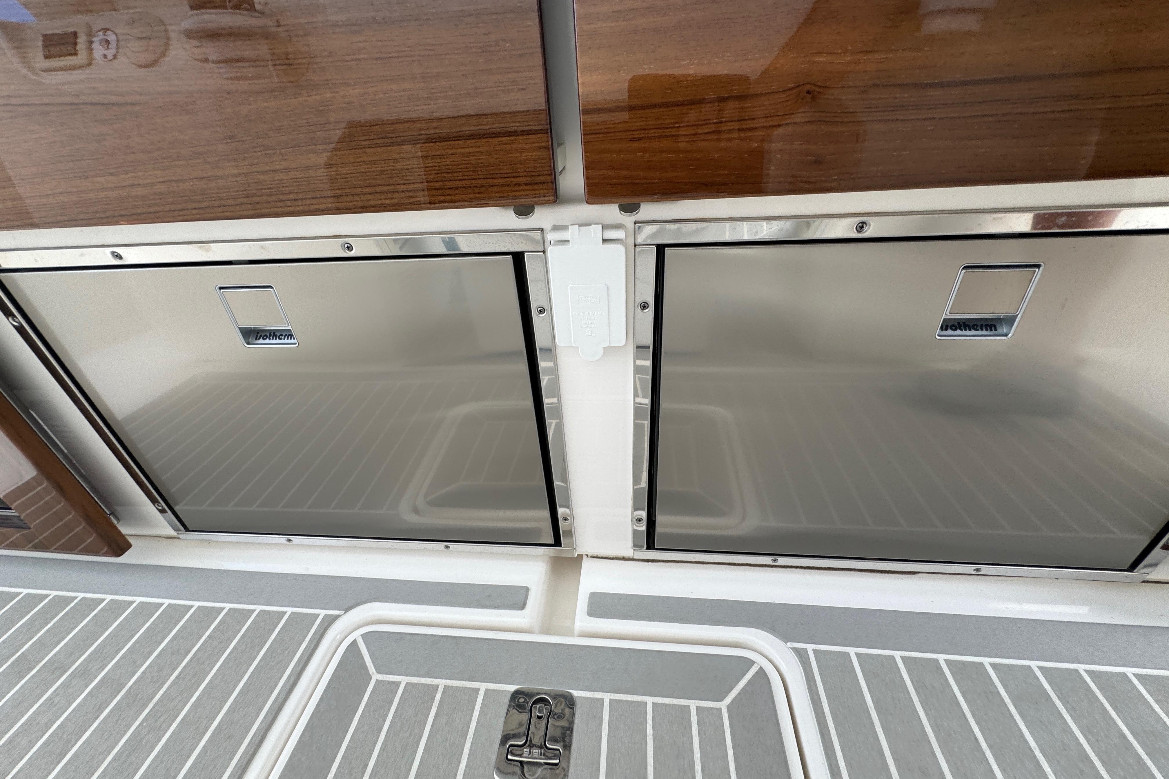 Stainless steel storage compartments on 2023 Tiara Yachts 43 LS boat deck.