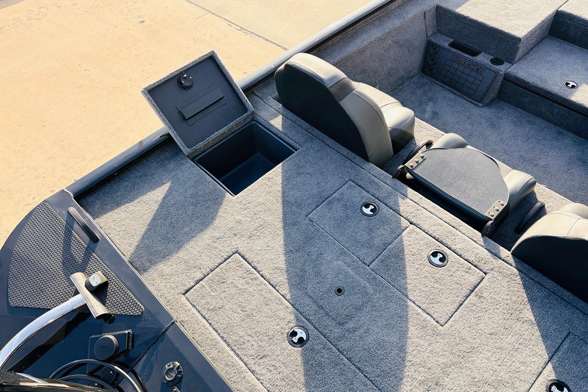 2025 Tracker Savage 215 boat interior with storage compartments and seating.