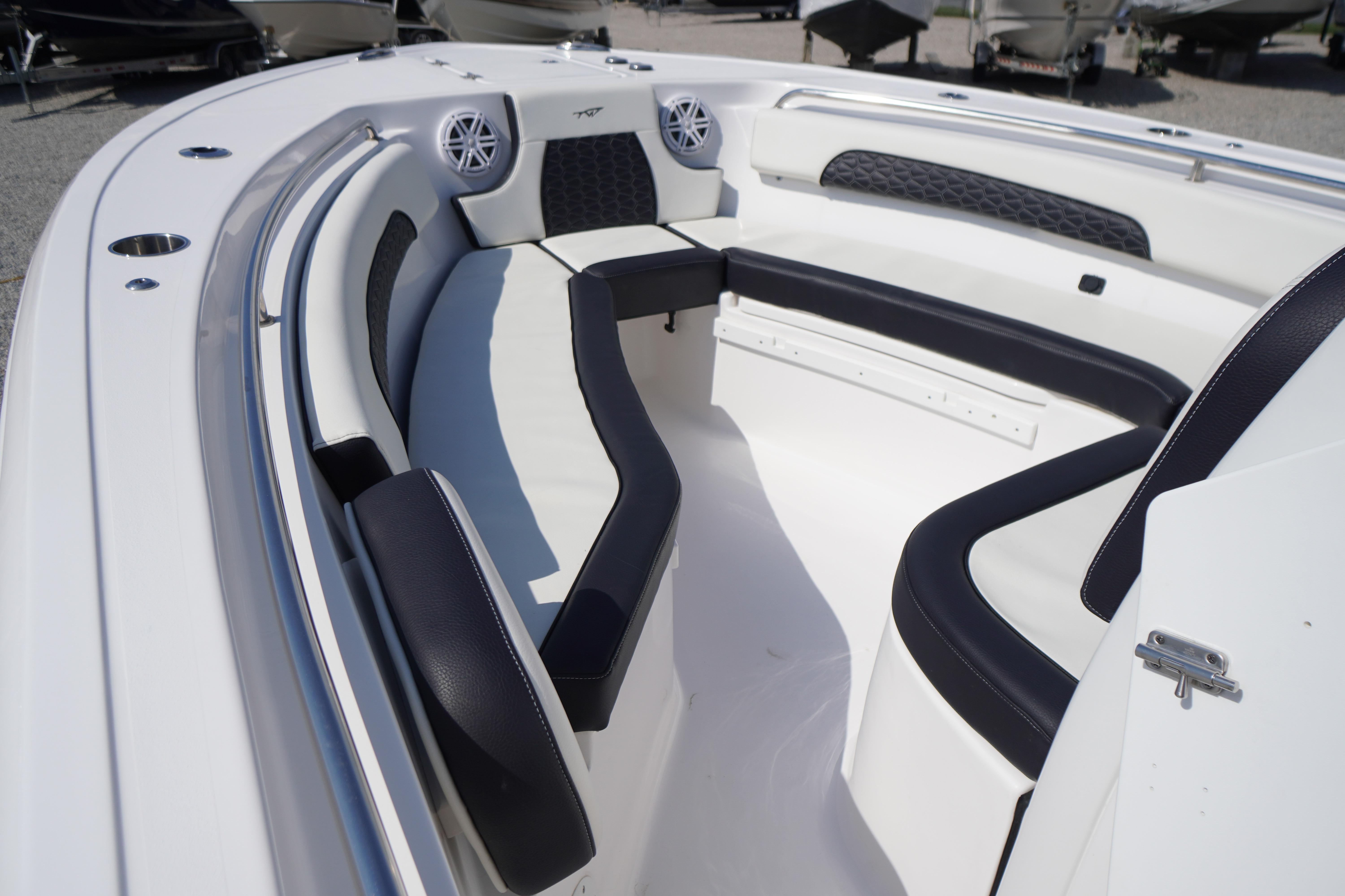 2025 Tidewater 232 SS boat interior with cushioned seating and modern design.