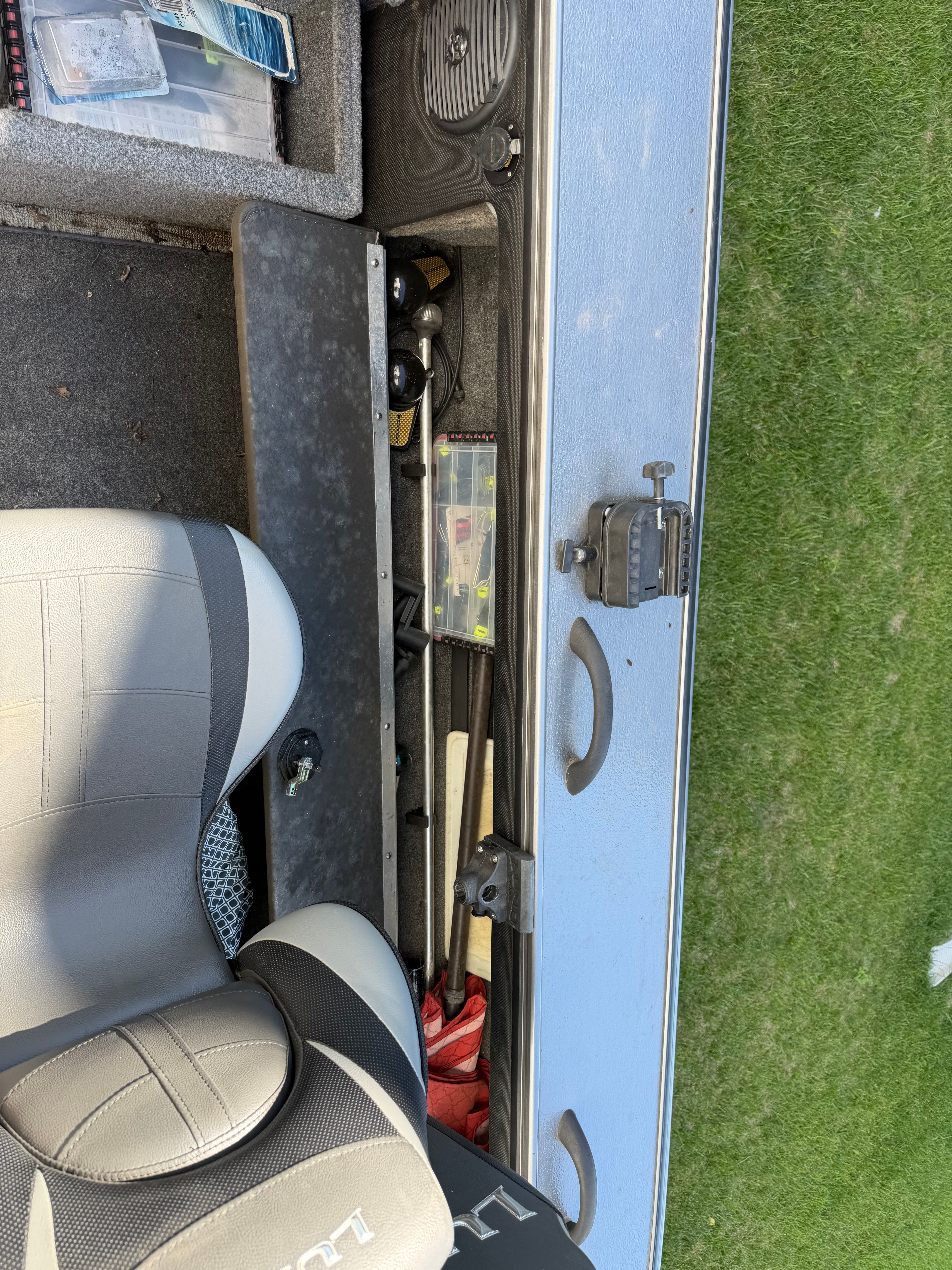 Interior view of a 2017 Lund Pro V 1975 boat with seat and storage.