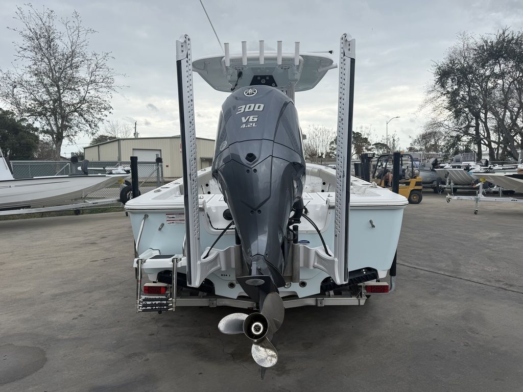 Rear view of a Sportsman Masters 247OE Bay Boat with a 300 HP V6 outboard motor.