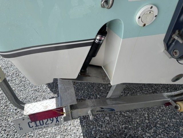 Rear view of a 2015 NauticStar 25 XS boat on a trailer.