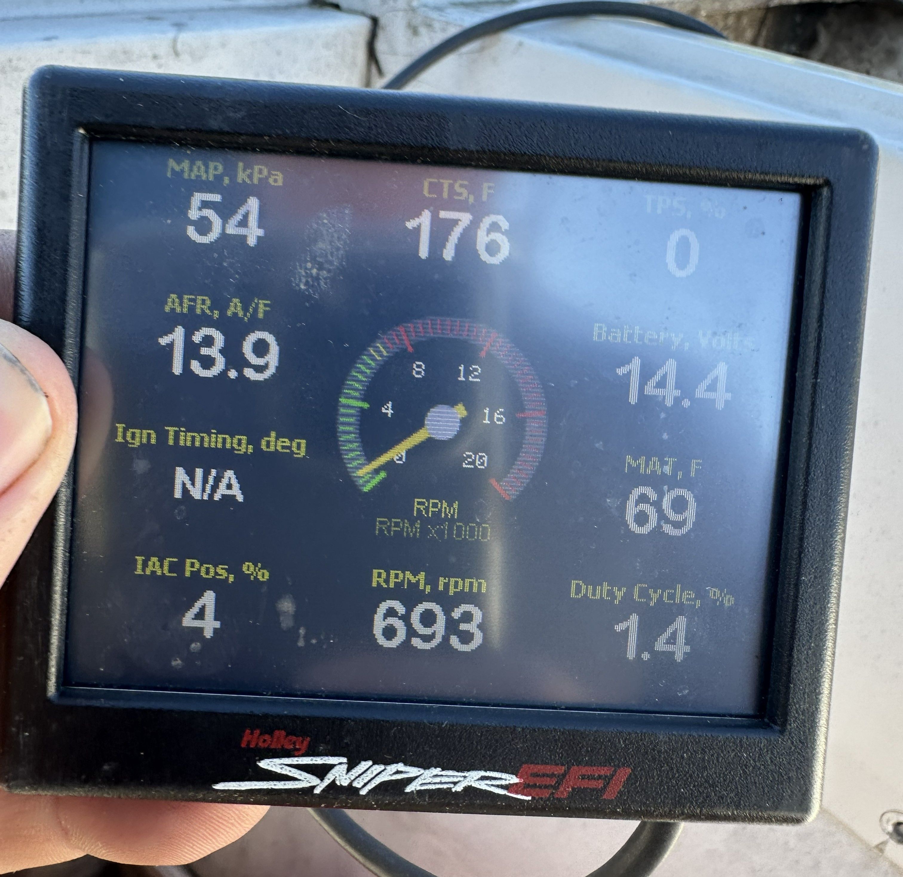 A Holley Sniper EFI screen displays various engine parameters, including RPM and battery status.