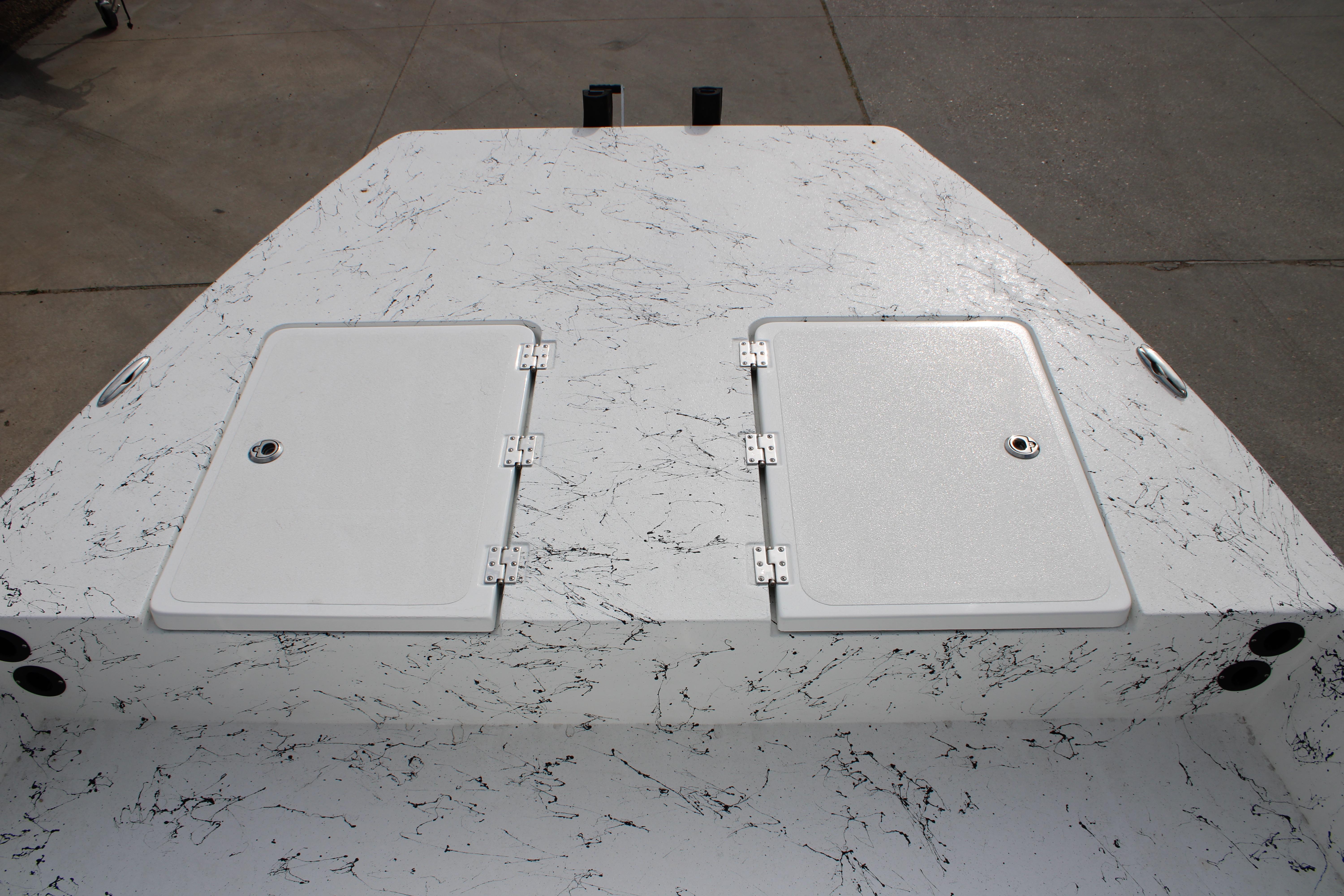 2026 Freedom Boats 19 PATRIOT deck with dual storage hatches, marbled finish.