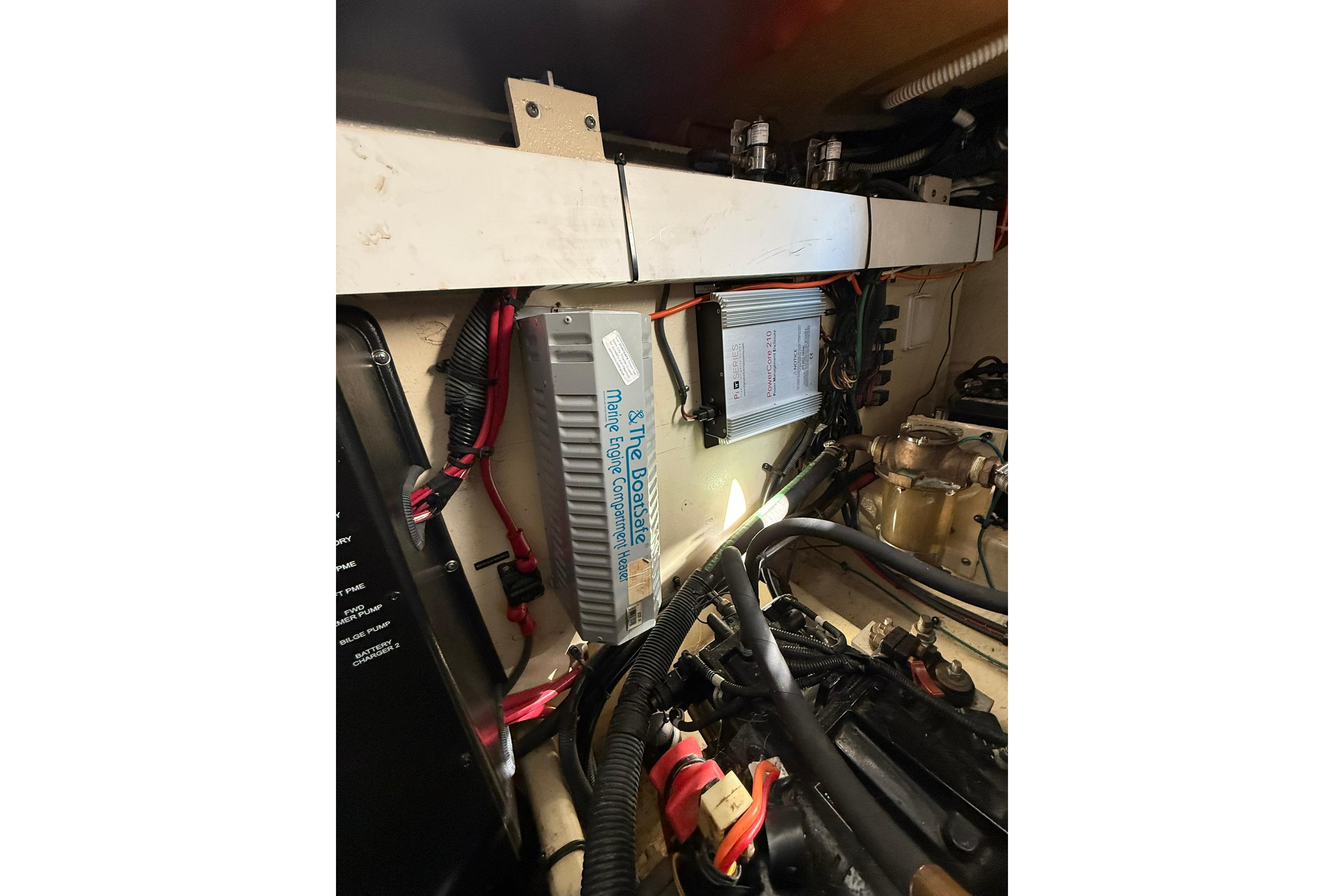 Engine compartment of 2009 Sea Ray 350 Sundancer with marine components and wiring.