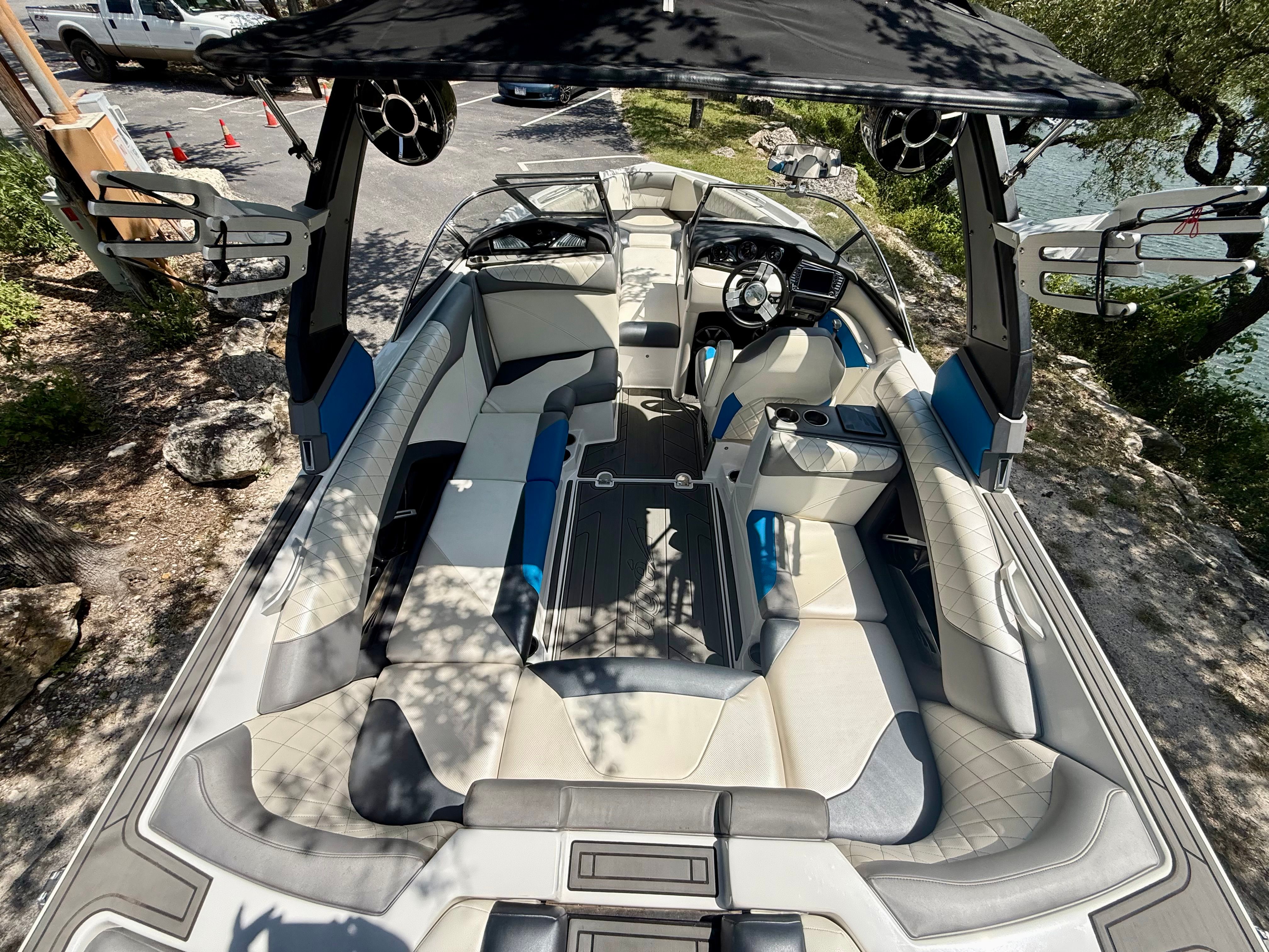 The image shows the interior of a 2017 Tigé Z3 boat with modern seating and a helm.