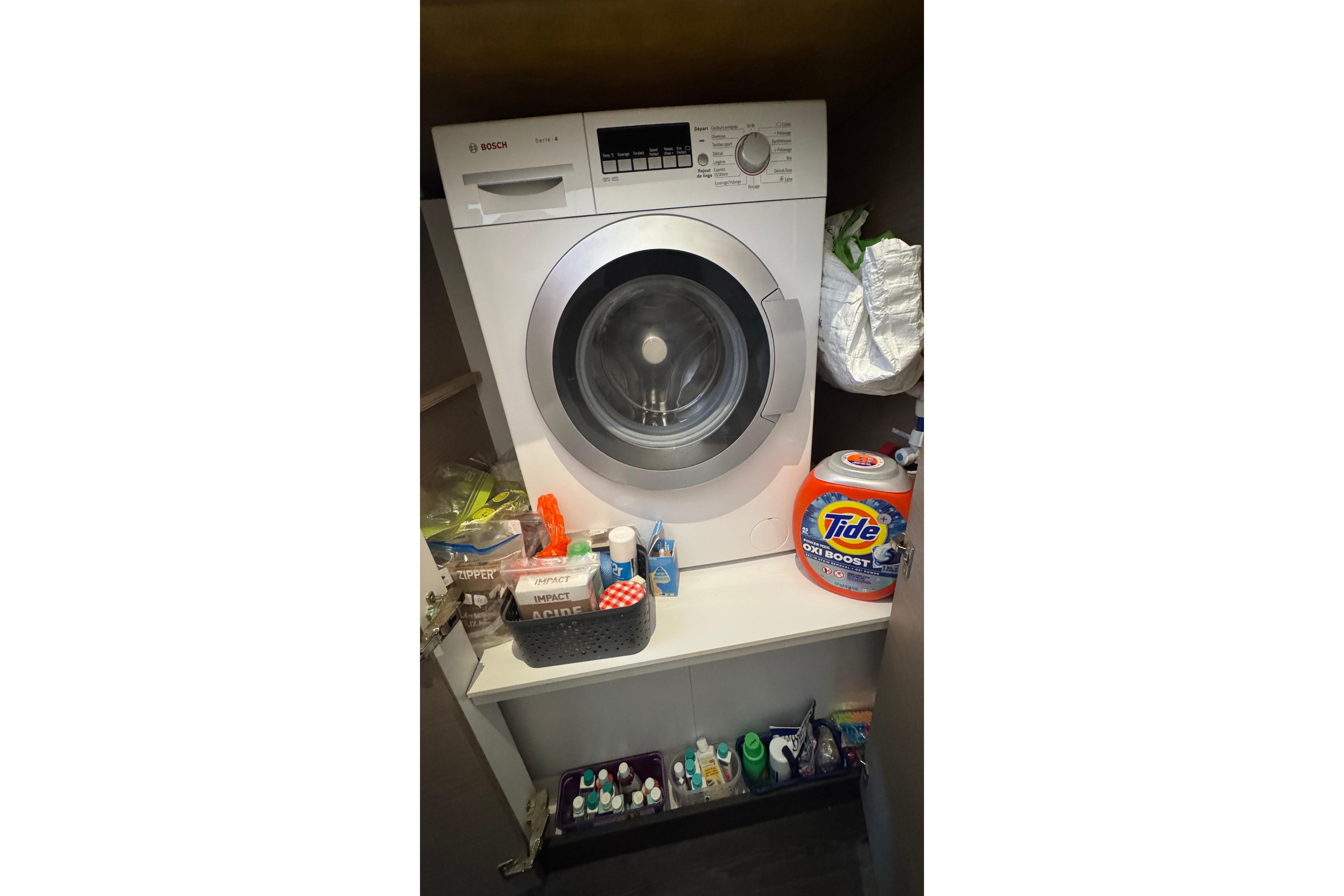 Laundry area on a 2020 Fountaine Pajot Saona 47 with Bosch washer and cleaning supplies.